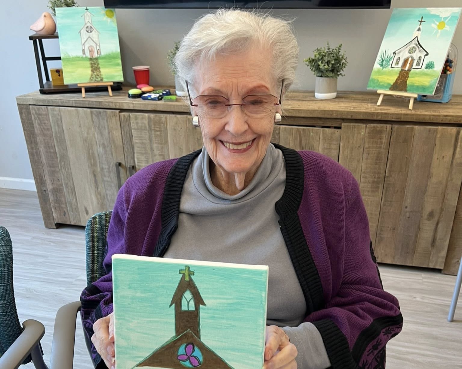 Staff member and a smiling resident at The Barclay at Whiskey Road in Aiken, South Carolina