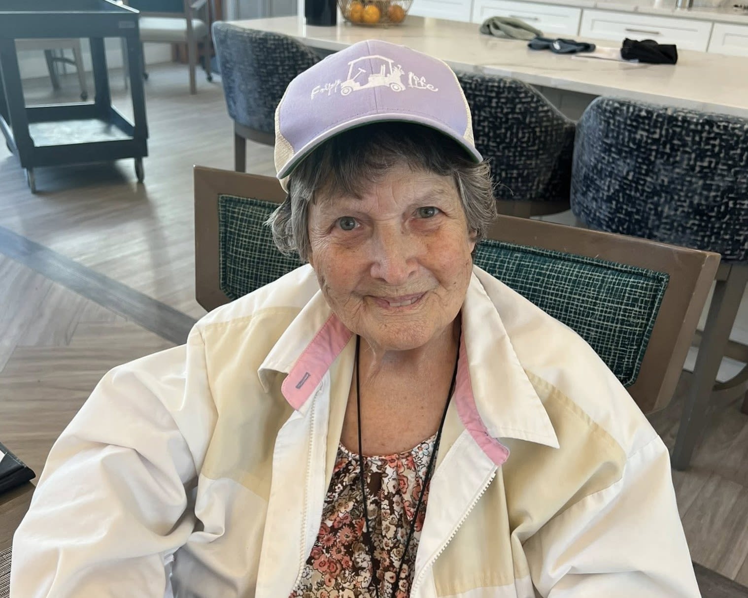 Staff and resident in matching hats at The Barclay at Whiskey Road in Aiken, South Carolina