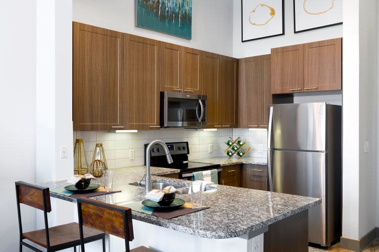 Kitchen with granite countertop at South 400 in Fort Worth, Texas