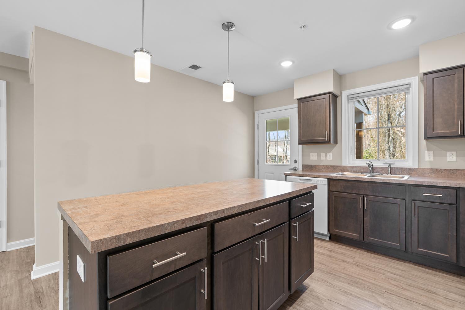Kitchen with island and pendant lighting at Brock Bridge Landing in Jessup, Maryland