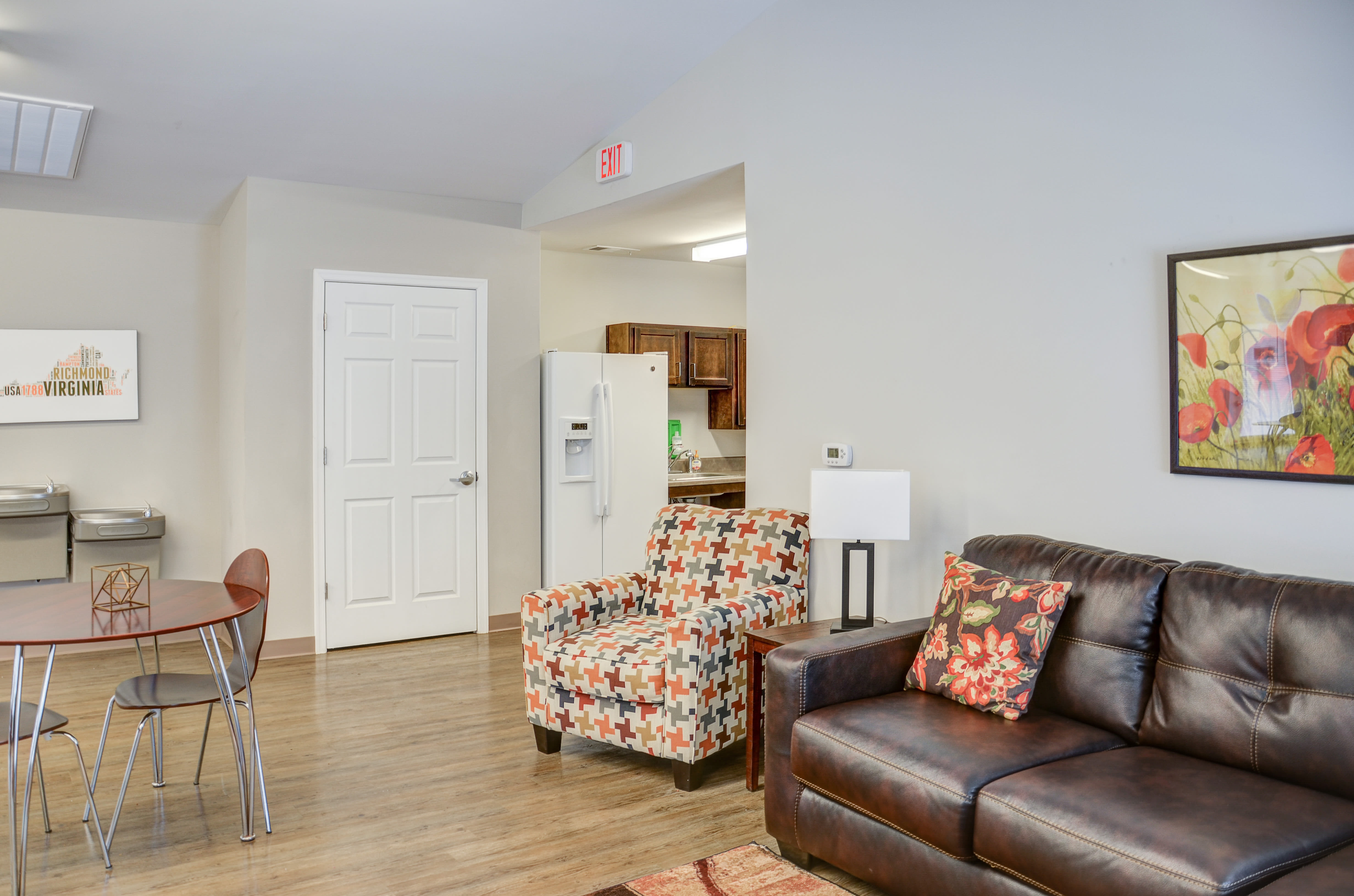 Spacious community living space with dining area at Liberty Pointe in Petersburg, Virginia