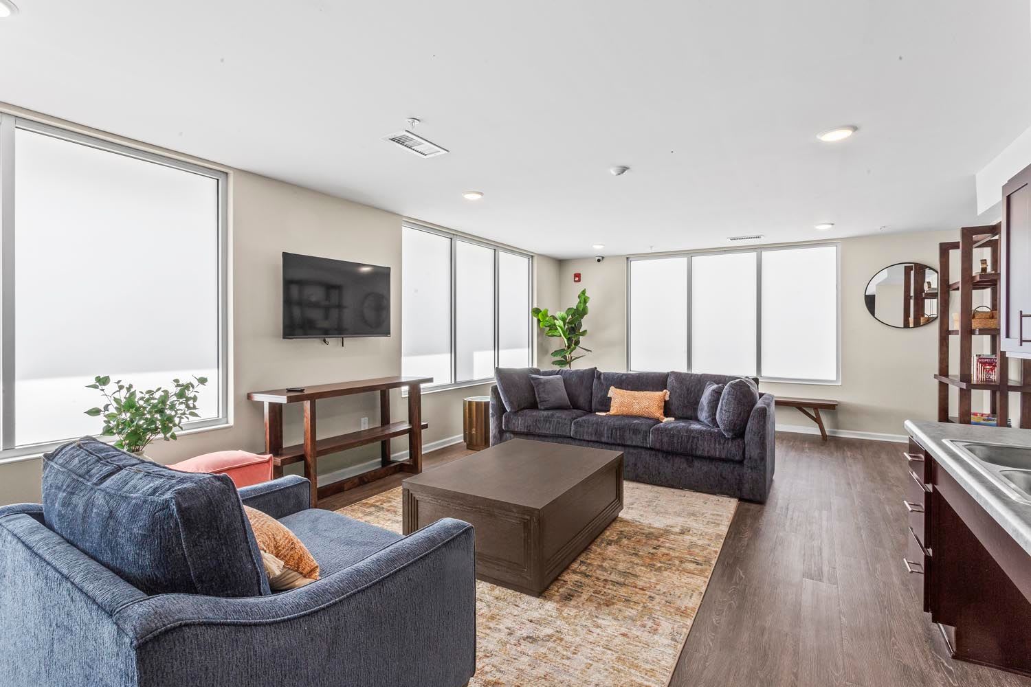 Community room with seating area at Stanton Park Apartments in Atlanta, Georgia