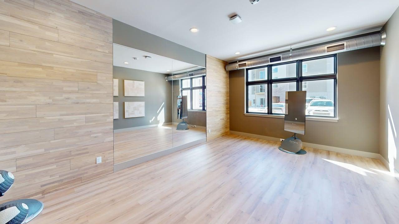 An open space with a big mirror and window at The Block at Petoskey in Petoskey, Michigan