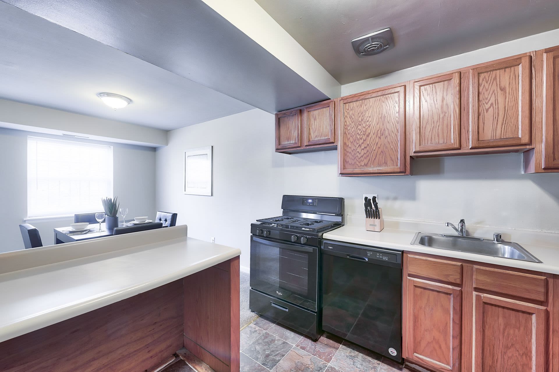 Kitchen with appliances at Woodington West Apartments in Baltimore, Maryland