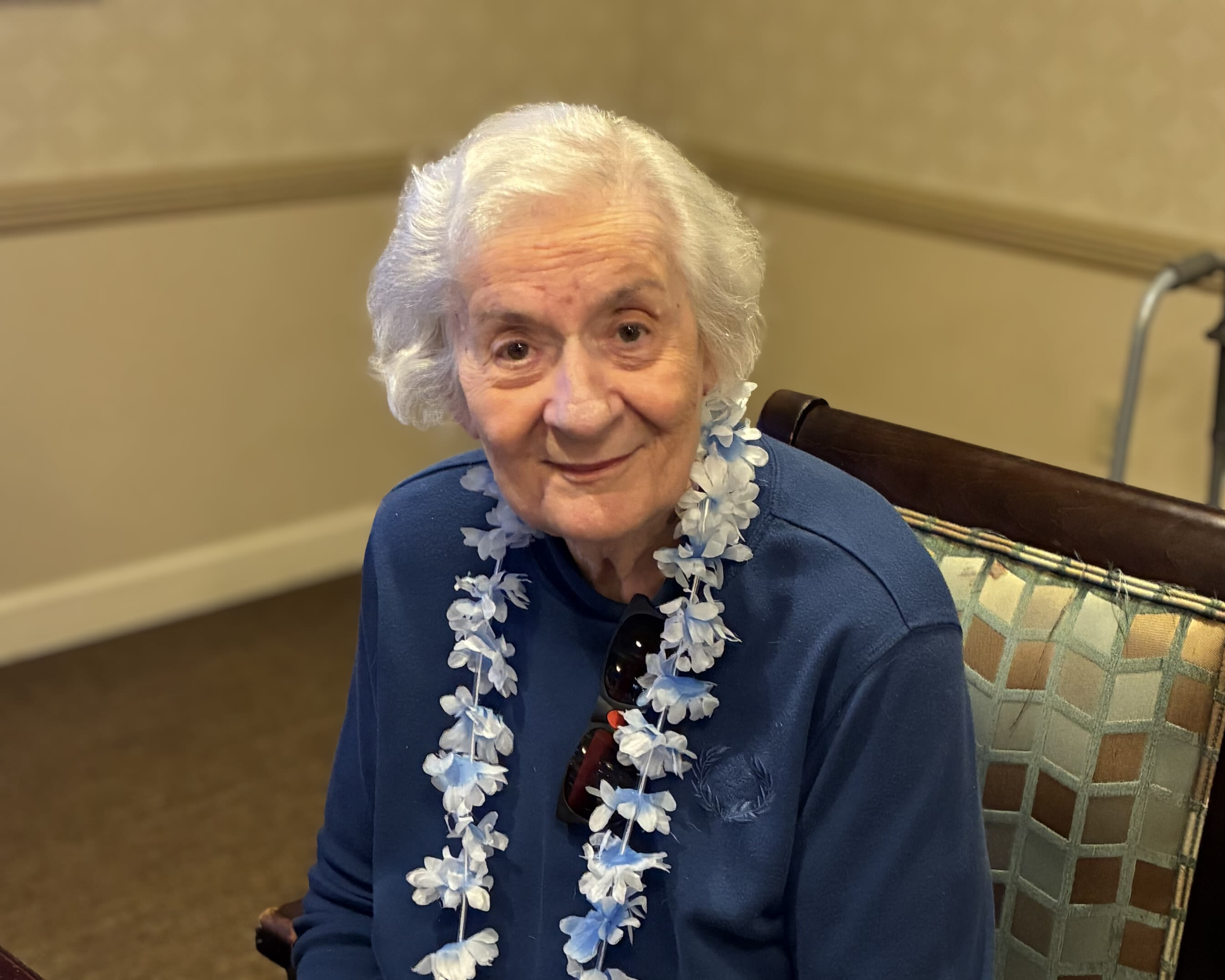A resident wearing a lei at Glenncrest at Buckhead in Atlanta, Georgia