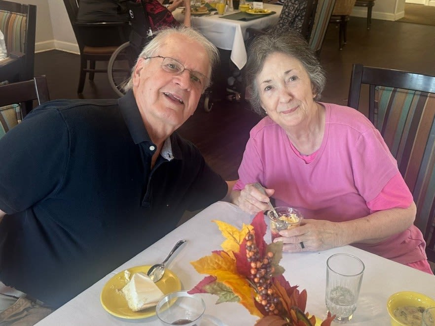 Two residents enjoying cake at Glenncrest at Decatur in Decatur, Georgia