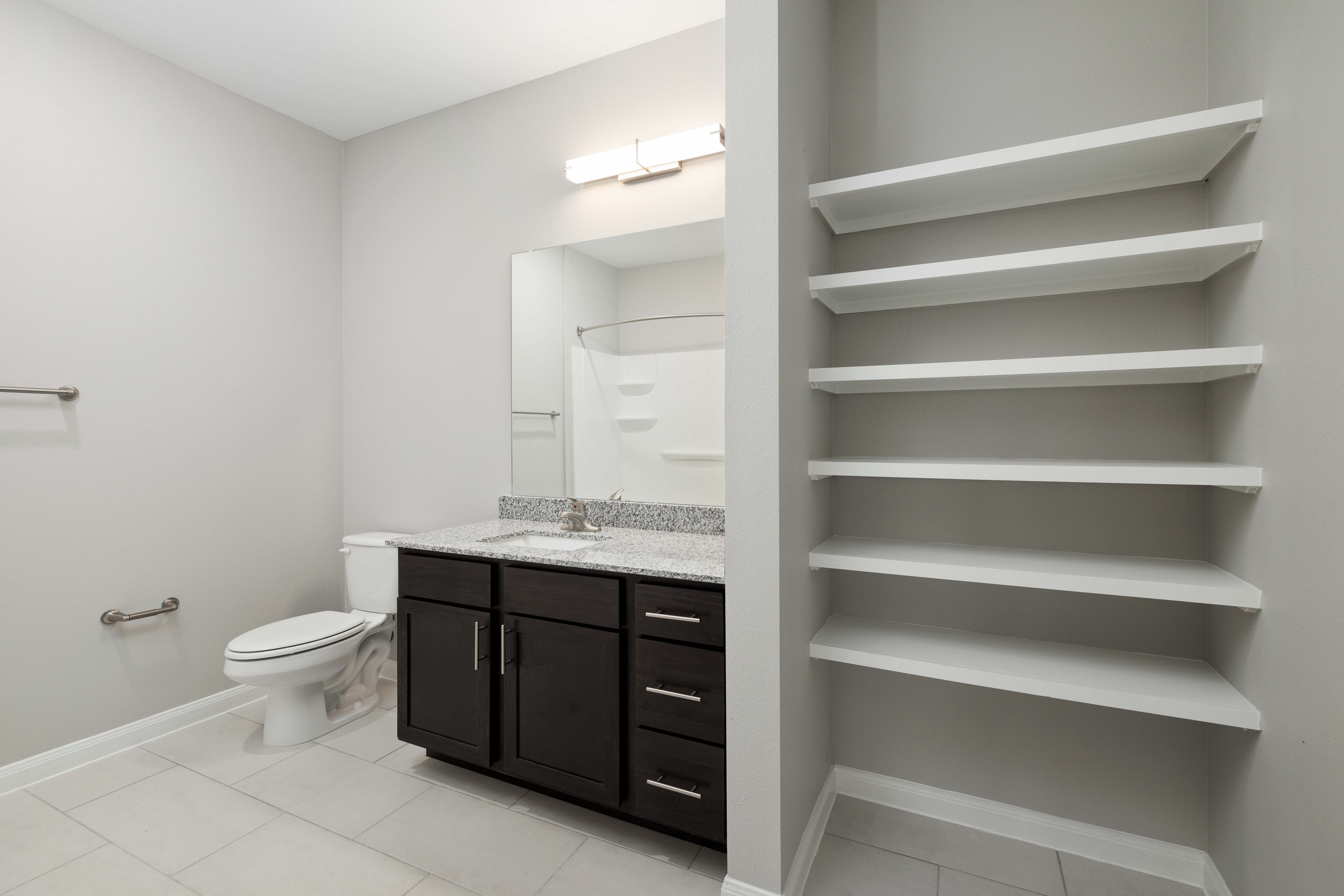Bathroom with storage units at Legacy On Kiest in Dallas, Texas