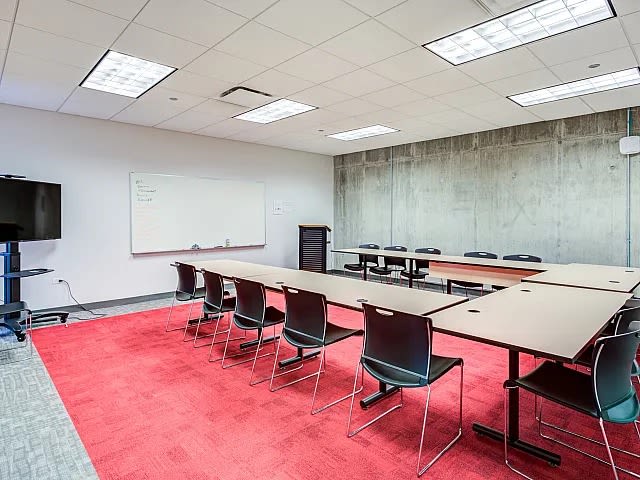 Conference room with table and chair at The Flats at East West University in Chicago, Illinois