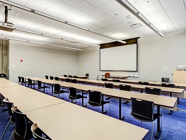 Conference room with projector facility at The Flats at East West University in Chicago, Illinois
