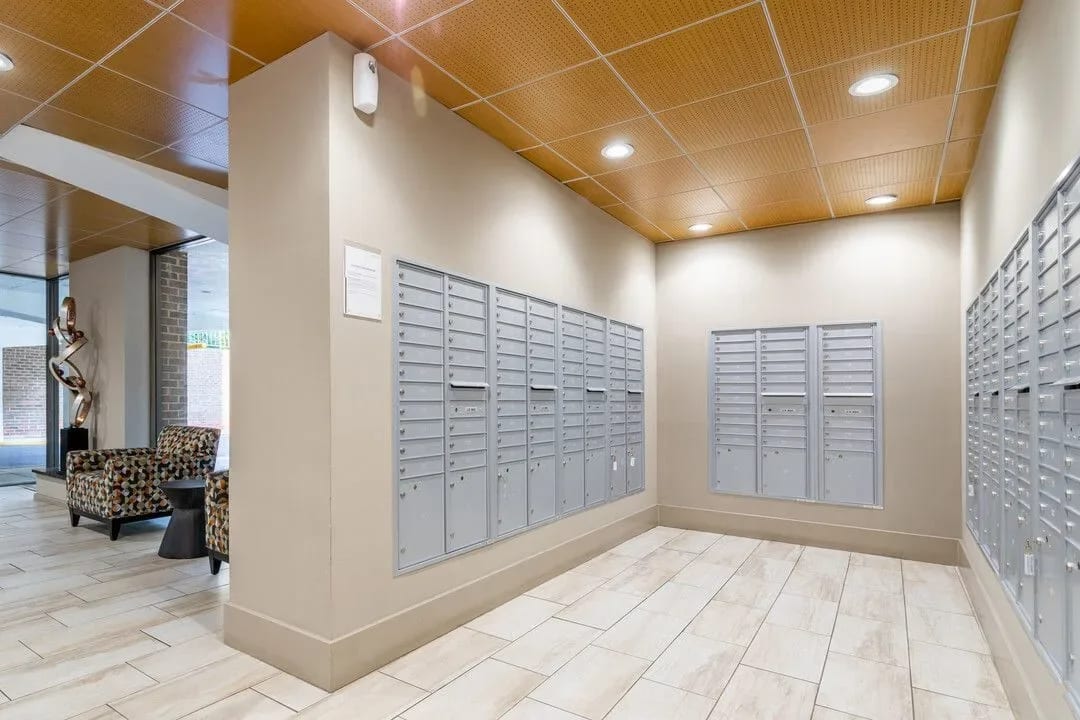 Mailboxes on wall with tiled floor at Charlestowne North in Greenbelt, Maryland