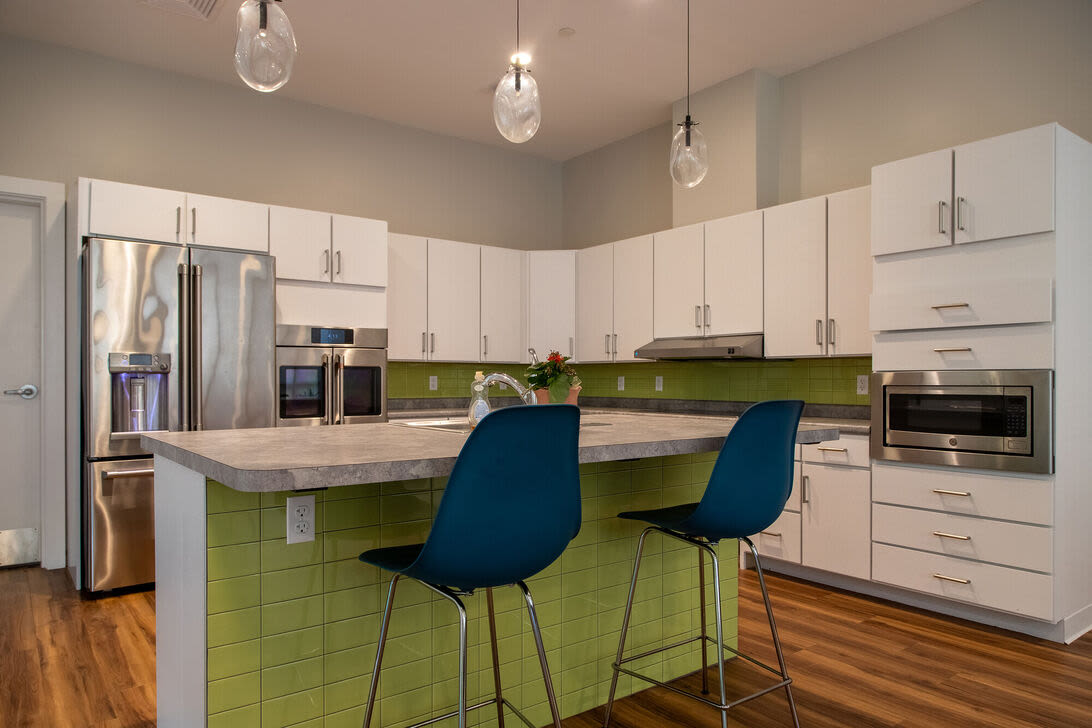 Clubhouse kitchen with island at Hearth at Four Corners in Dorchester, Massachusetts, 