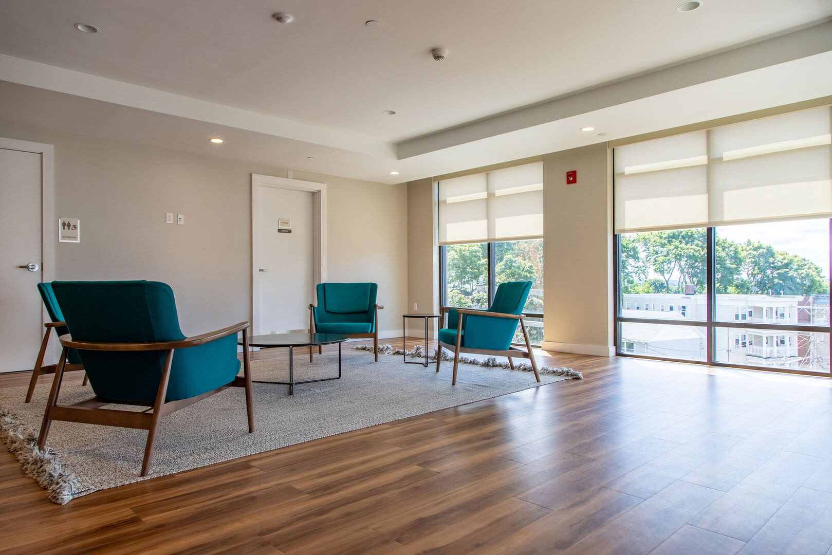 Clubhouse with large window at Hearth at Four Corners in Dorchester, Massachusetts, 