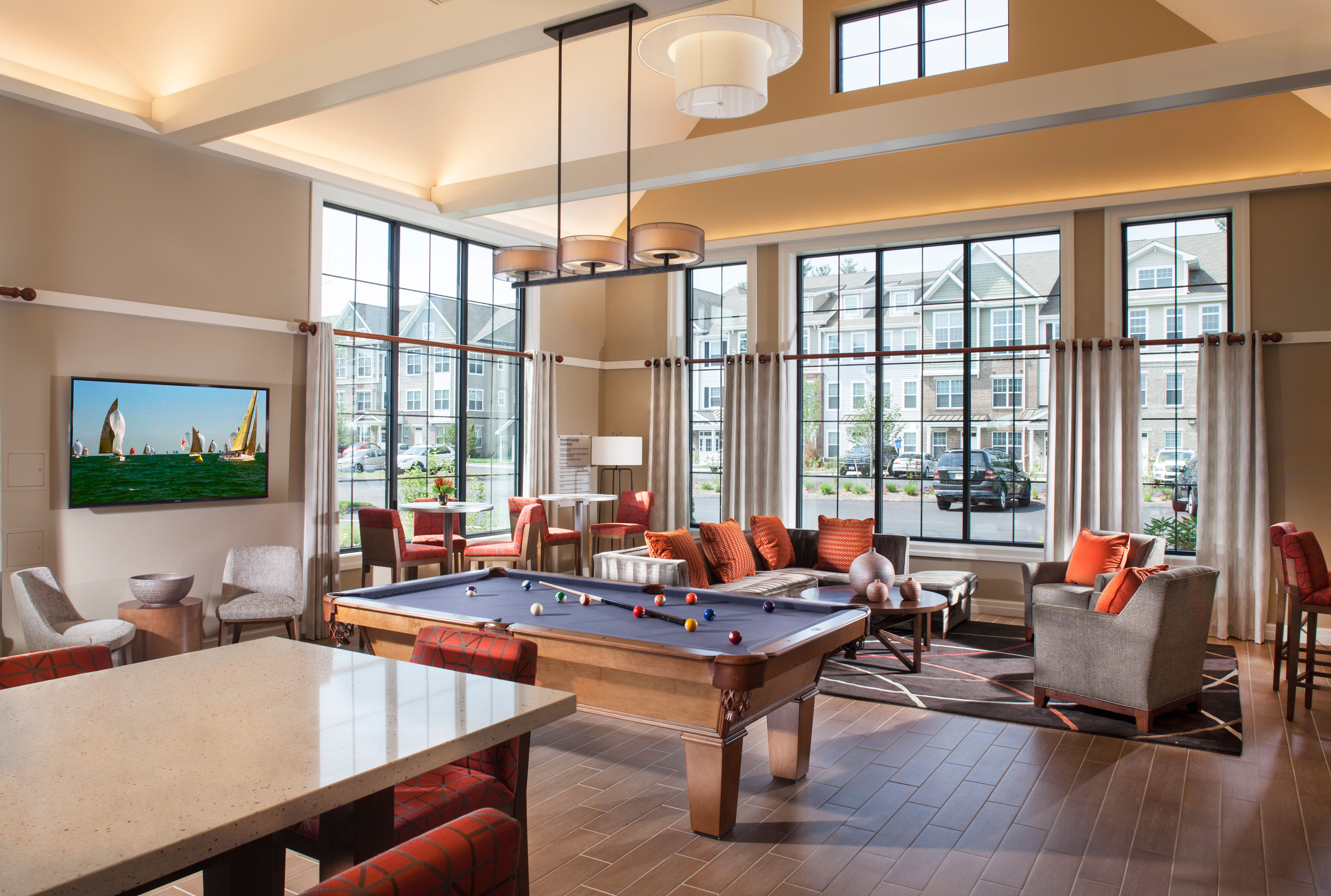 Flatscreen TV, billiards table, and more for residents to enjoy in the clubhouse at Prynne Hills in Canton, MA