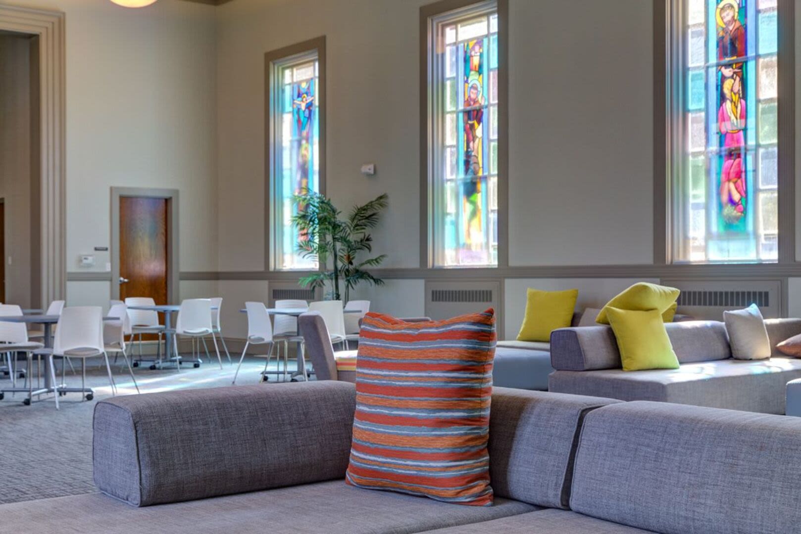 Community lounge area with seating space at Bethany Apartments in Hanover, Massachusetts