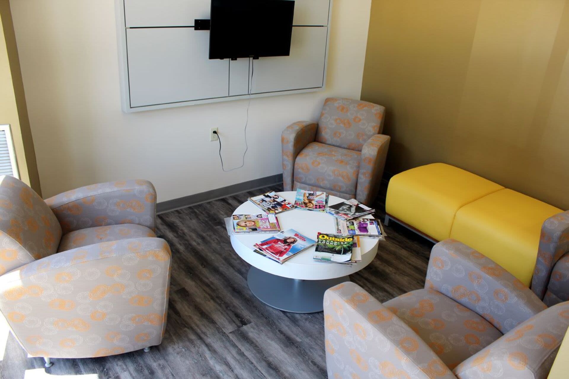 Seating area with flat-screen TV for entertainment at Bixby Brockton Apartments in Brockton, Massachusetts, 