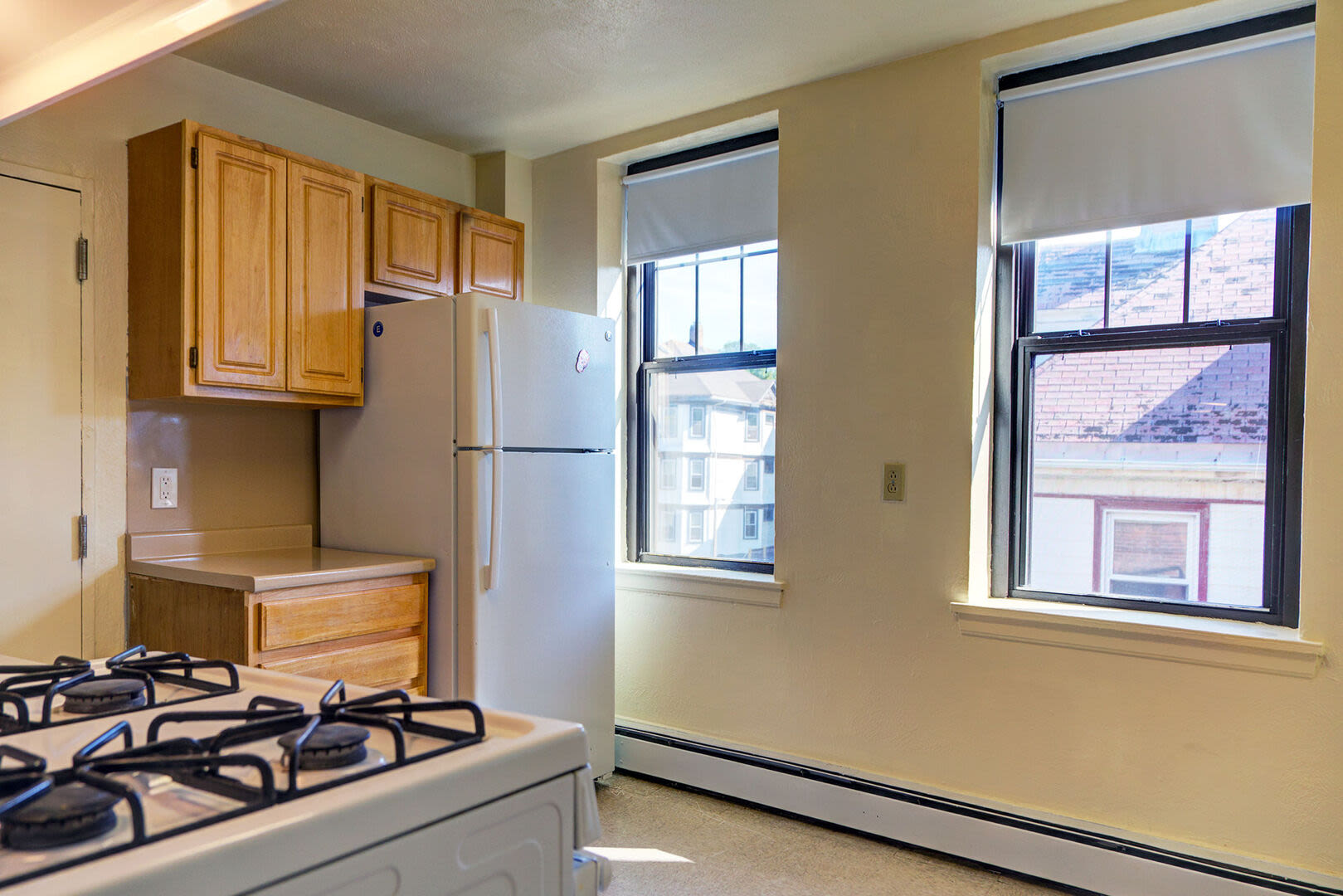 Refrigerator with stove at Blue Elm United Estates in Dorchester, Massachusetts