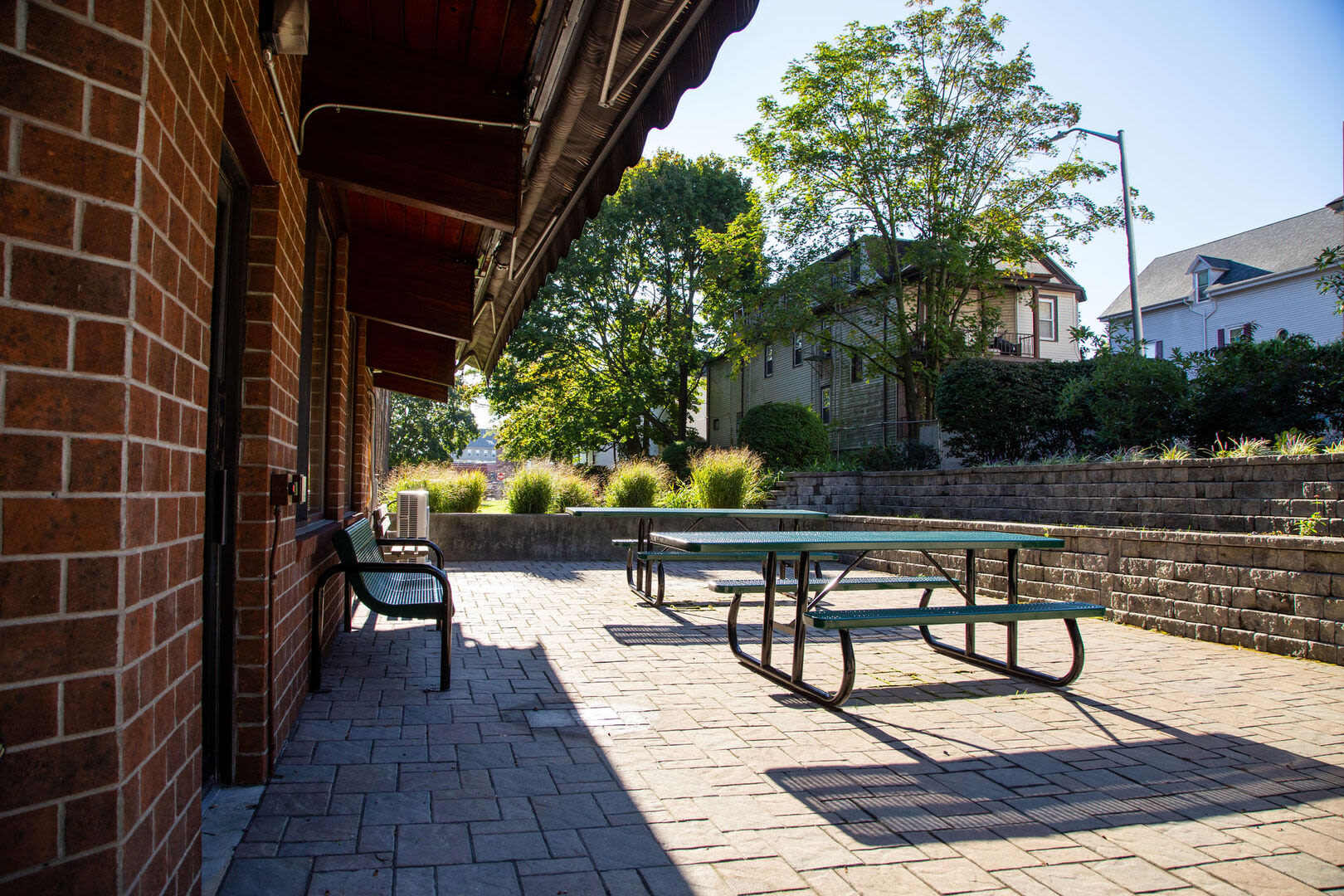 Outdoor space with a delightful courtyard and benches at Borden Place Apartments in Fall River, Massachusetts