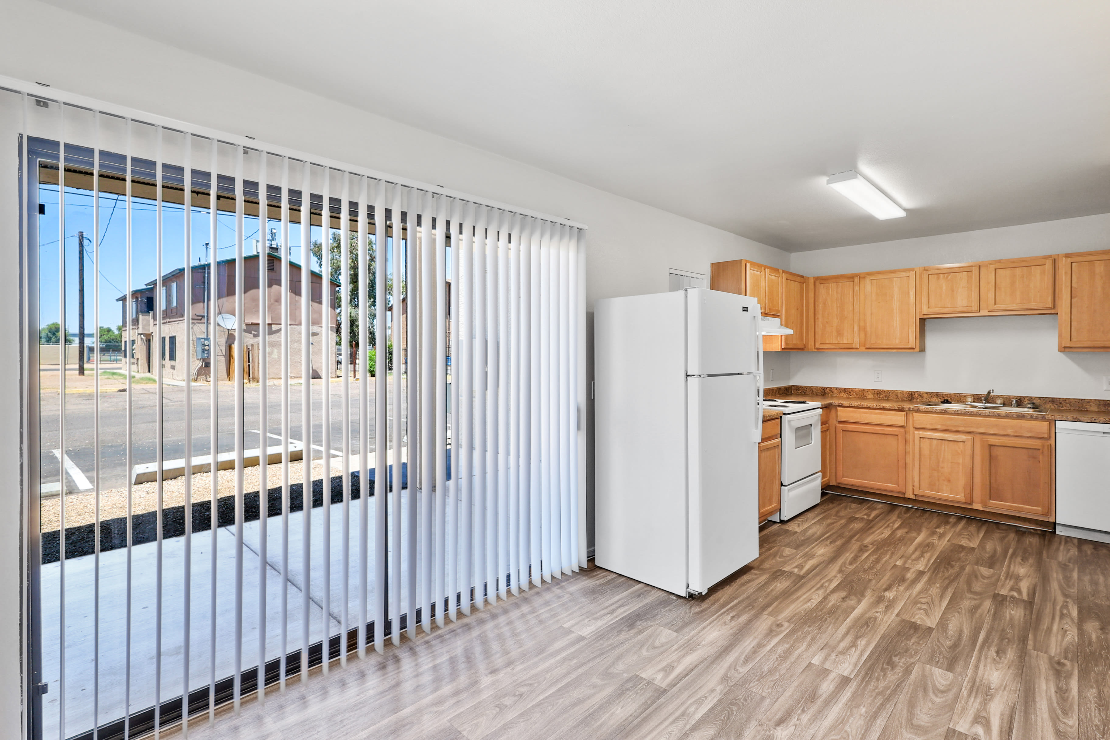 Spacious living room with patio access at Bella Vista Apartments in Phoenix,Arizona
