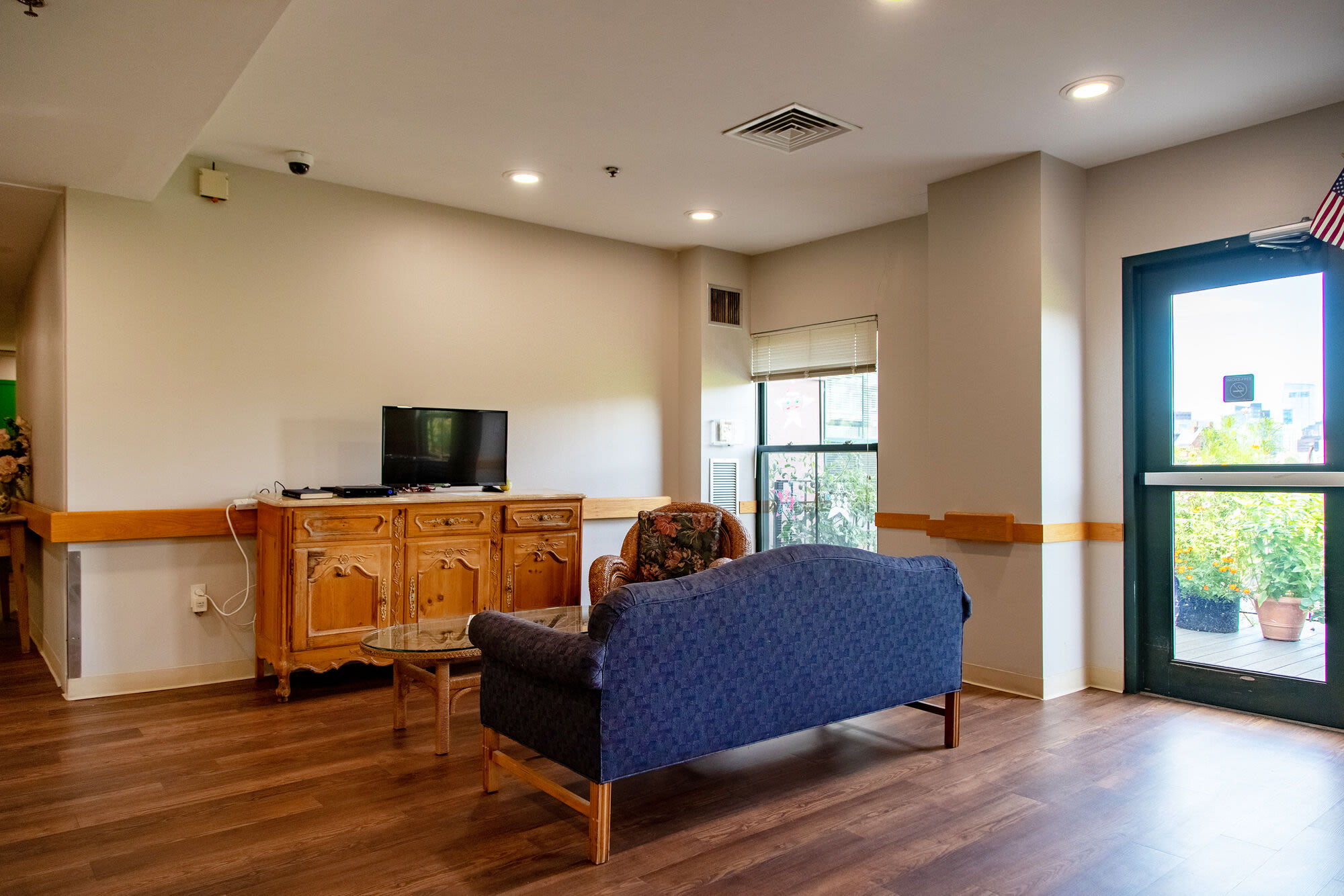 Sofa and television in lounge area at Hearth Anna Bissonnette House in Boston, Massachusetts