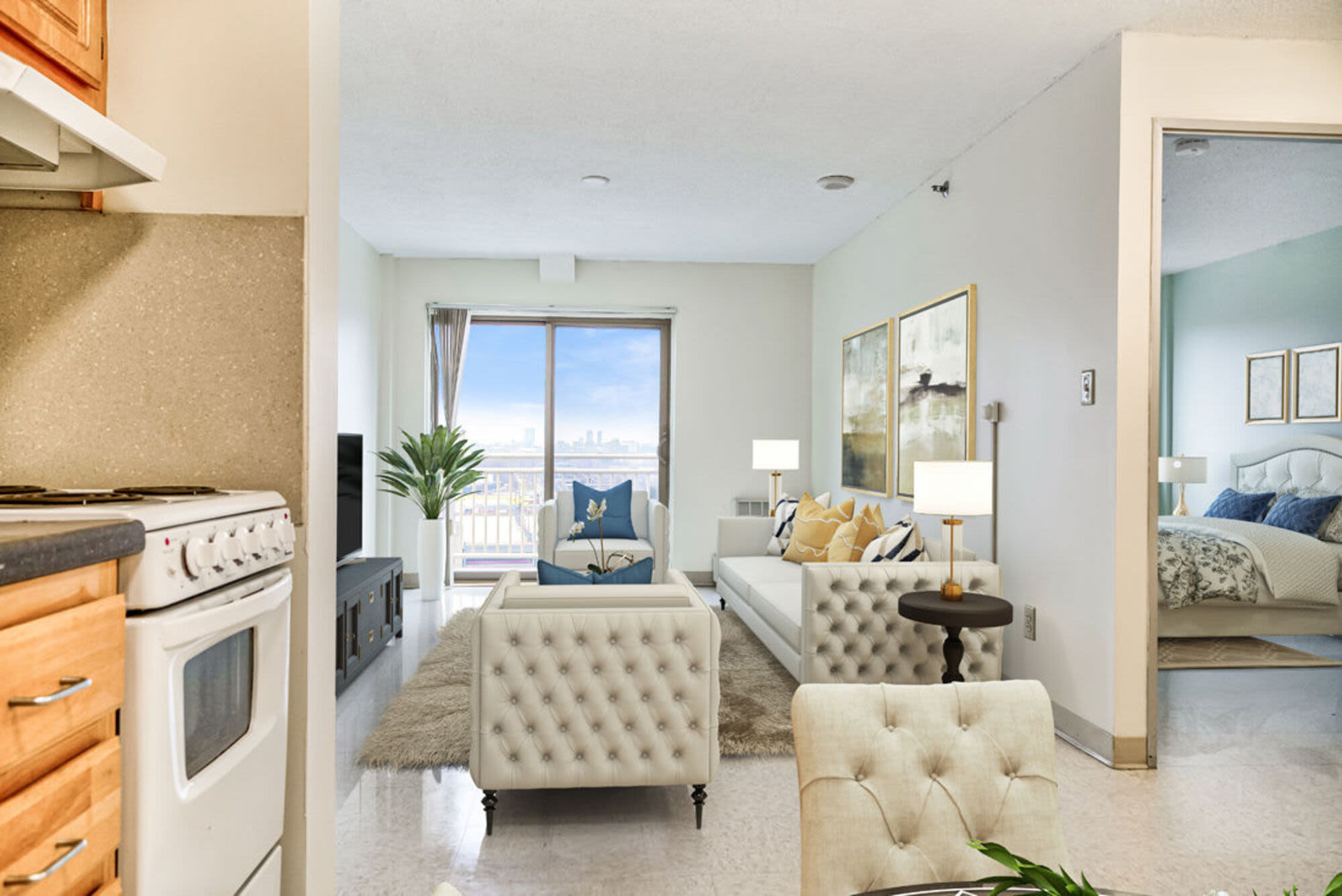 Living room with close access to patio at Heritage Apartments in Malden,Massachusetts