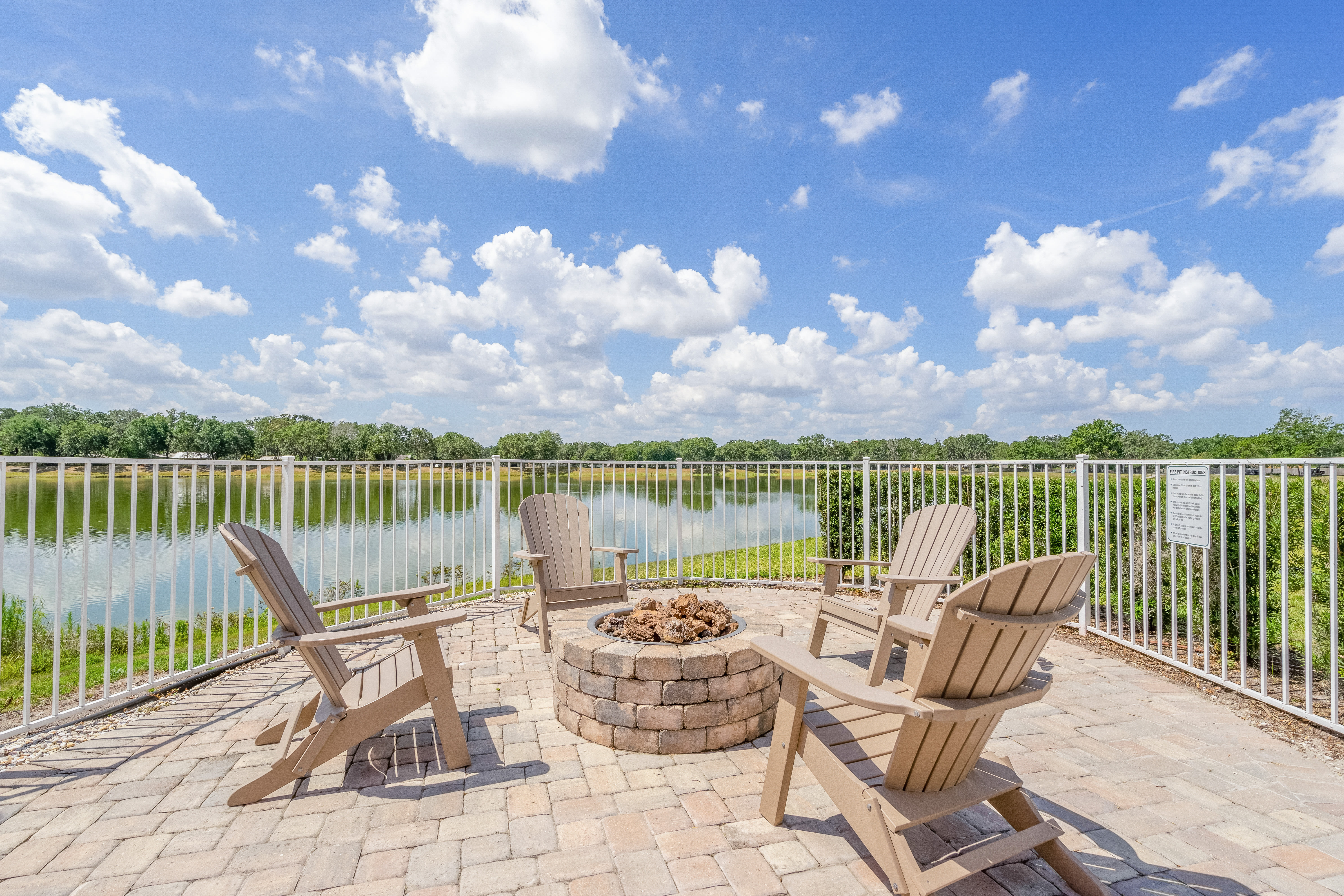 Patio beside the pool with firepit at Century Lakehouse, Plant City, Florida