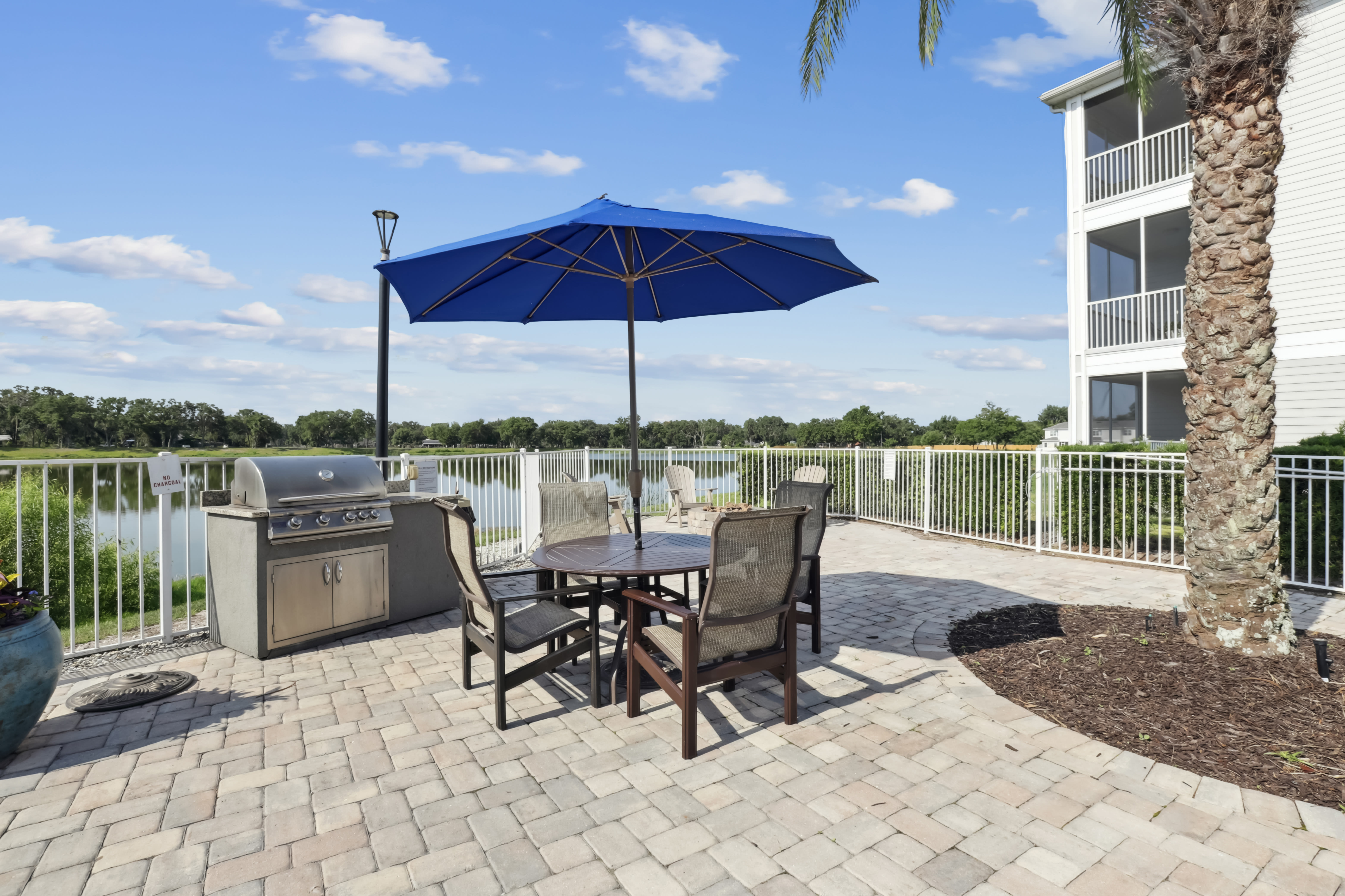 Outdoor grilling area with dining arrangement at Century Lakehouse, Plant City, Florida