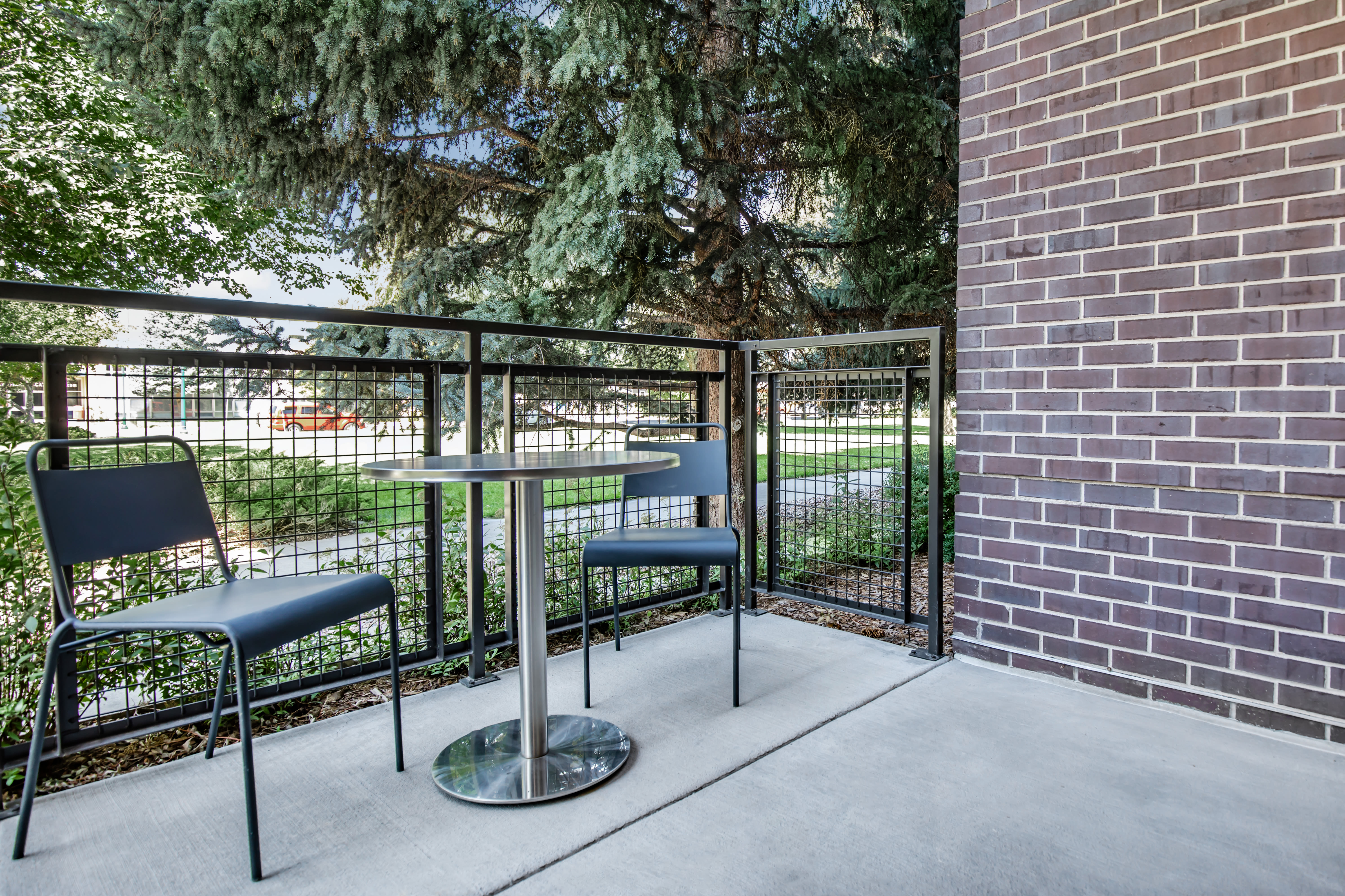 Outside chairs at Park Place Olde Town Apartments in Arvada, Colorado