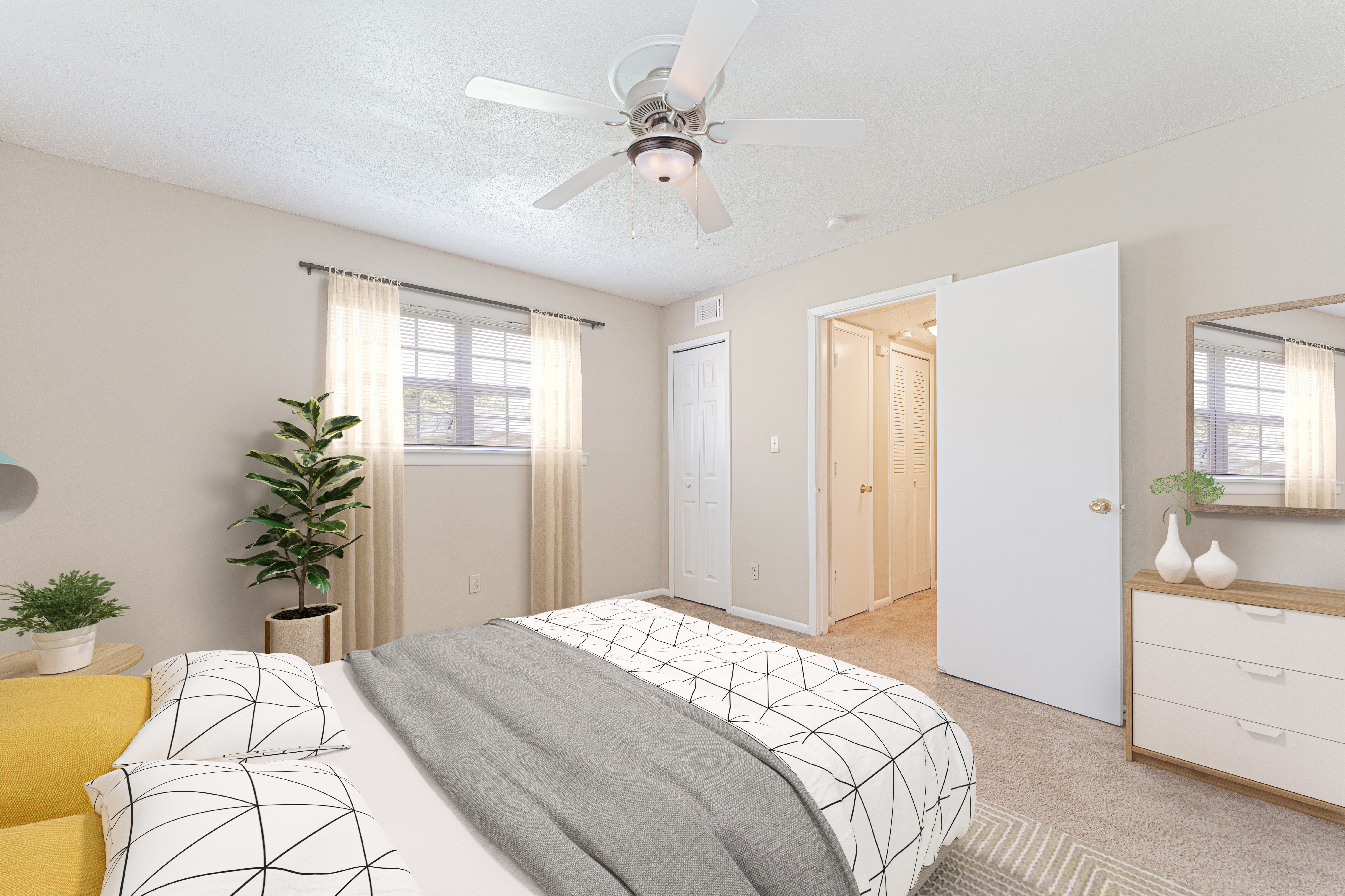 Bedroom with ceiling fan at Columbia Crossing Apartments in Columbia,Missouri