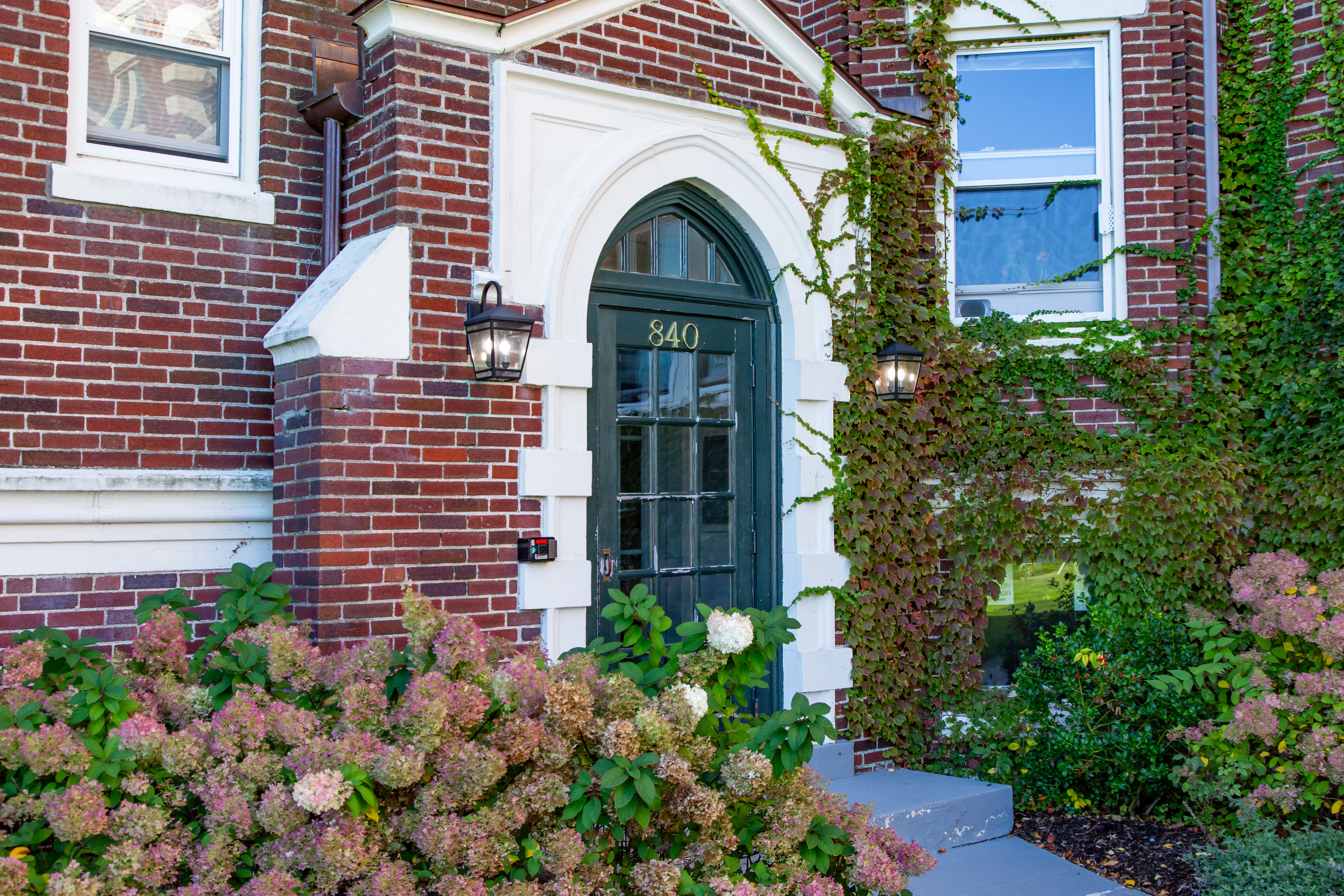 Community entry with plants at HCA 840-846 Mass Ave in Arlington, Massachusetts