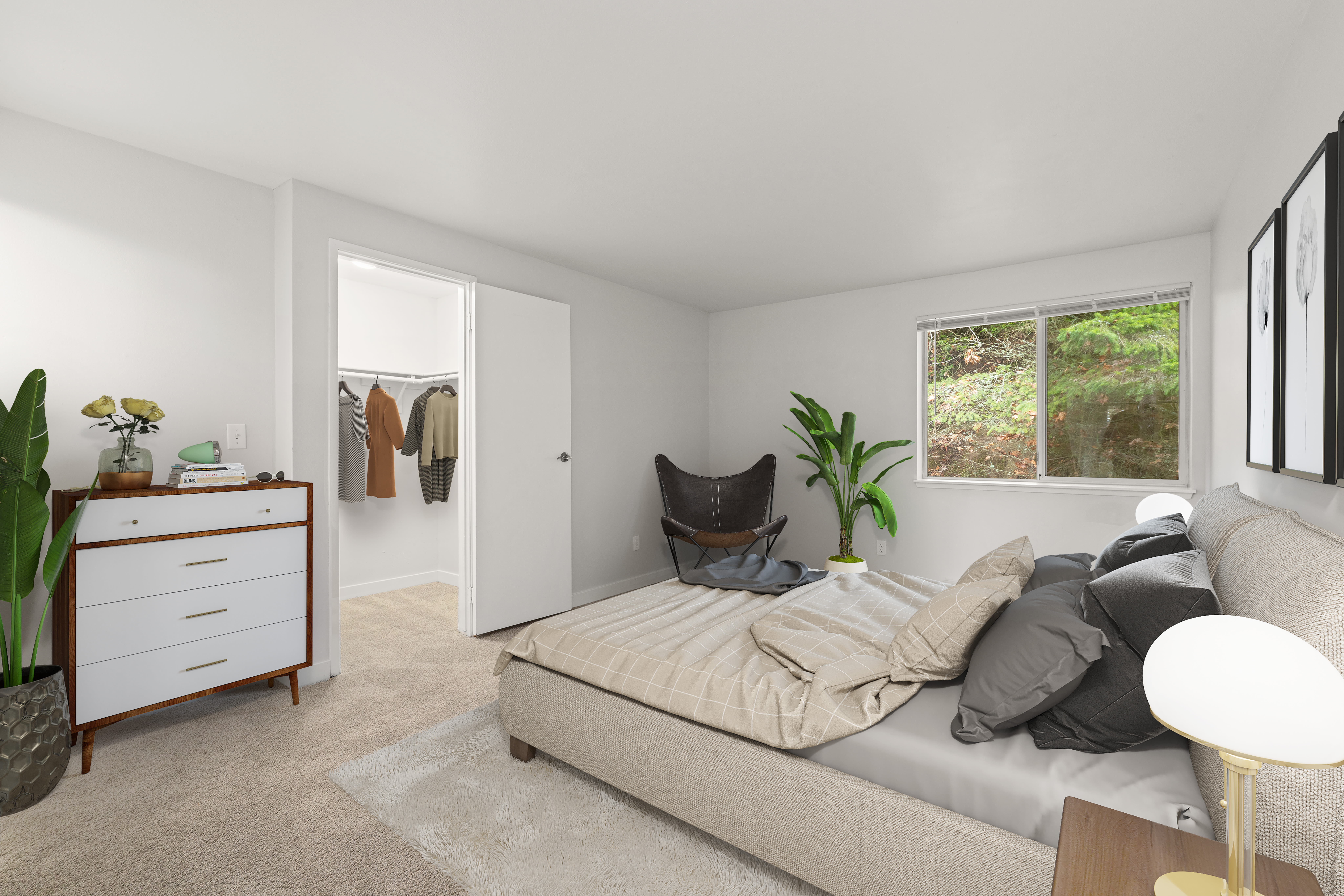 A spacious bedroom with closet at Wellington Apartments in Silverdale, Washington