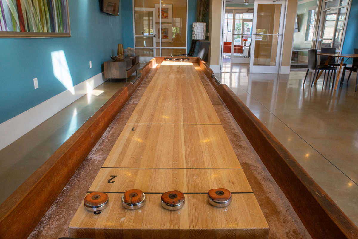 Game table in room with teal walls