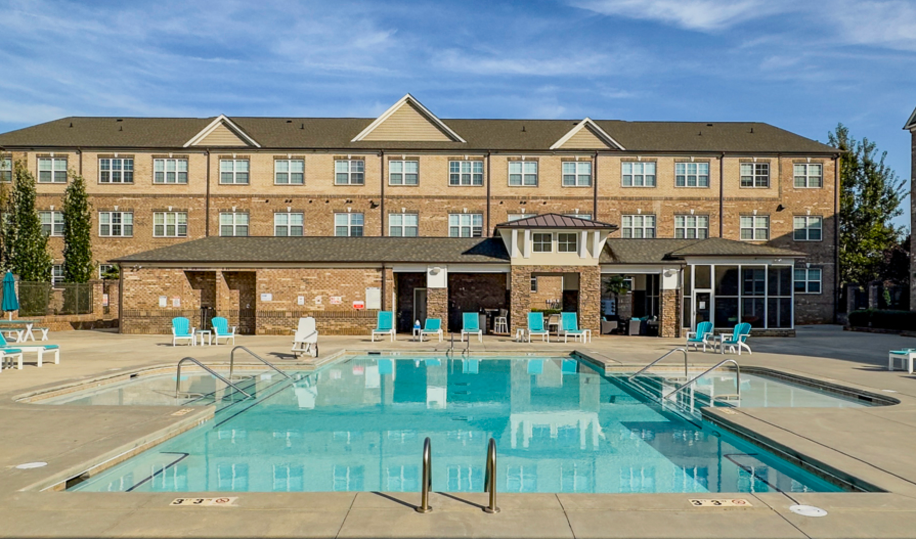 View of pool with building in background