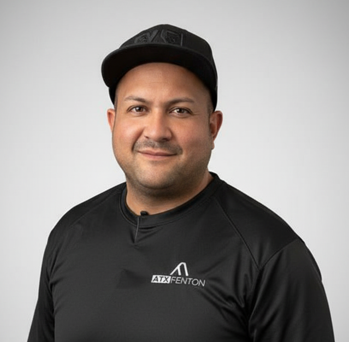 ATX Fenton team member in black shirt and cap, headshot at ATX Fenton in Austin, Texas