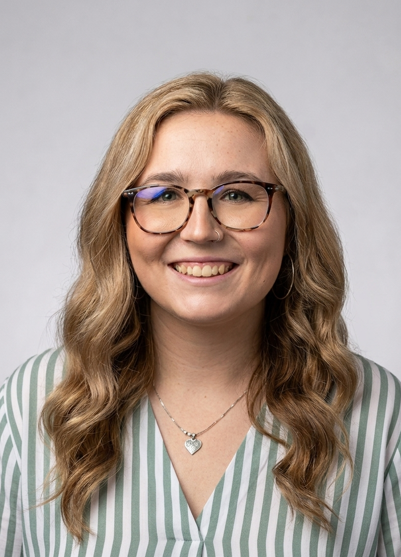 Team member headshot in green striped blouse at ATX Fenton in Austin, Texas