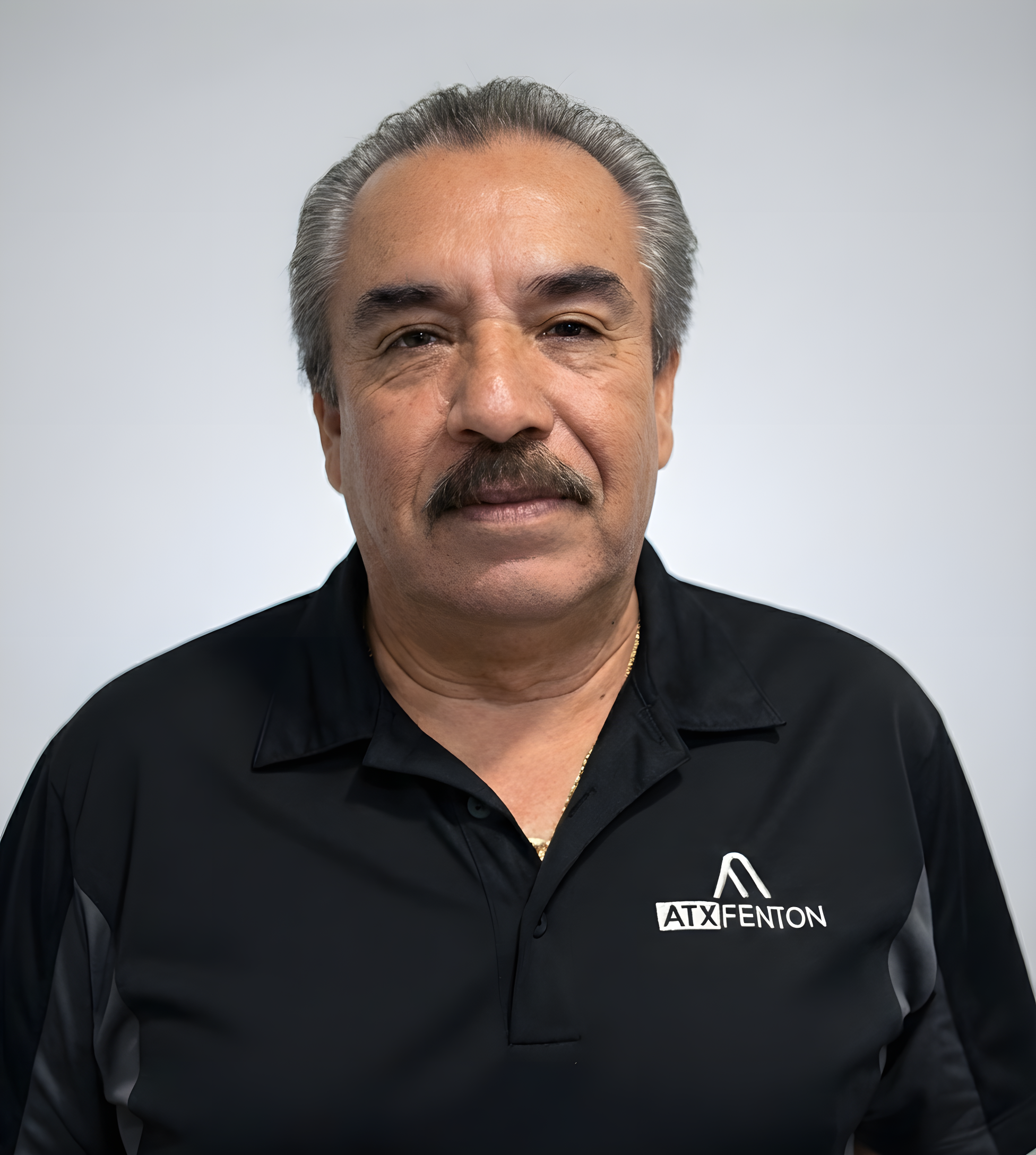 ATX Fenton team member headshot in black polo at ATX Fenton in Austin, Texas