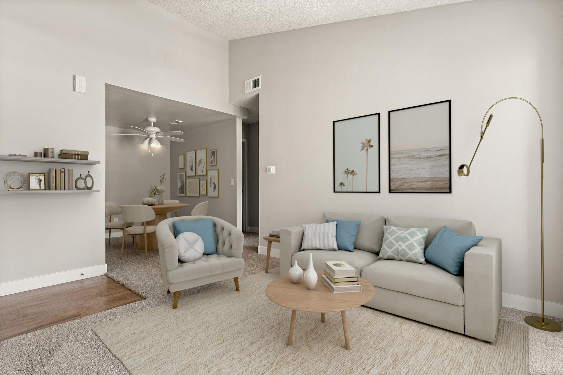 Modern living room with seating, wall art, and dining area at Colony Parc in Ventura, California