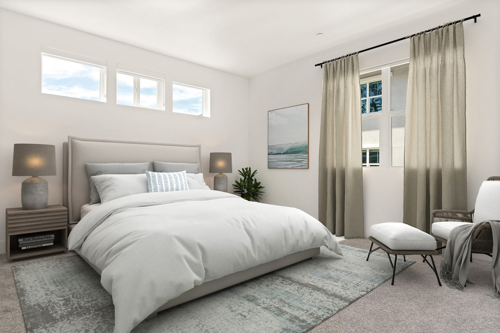 Bright bedroom with upholstered bed, side chairs, and natural light at Colony Parc in Ventura, California