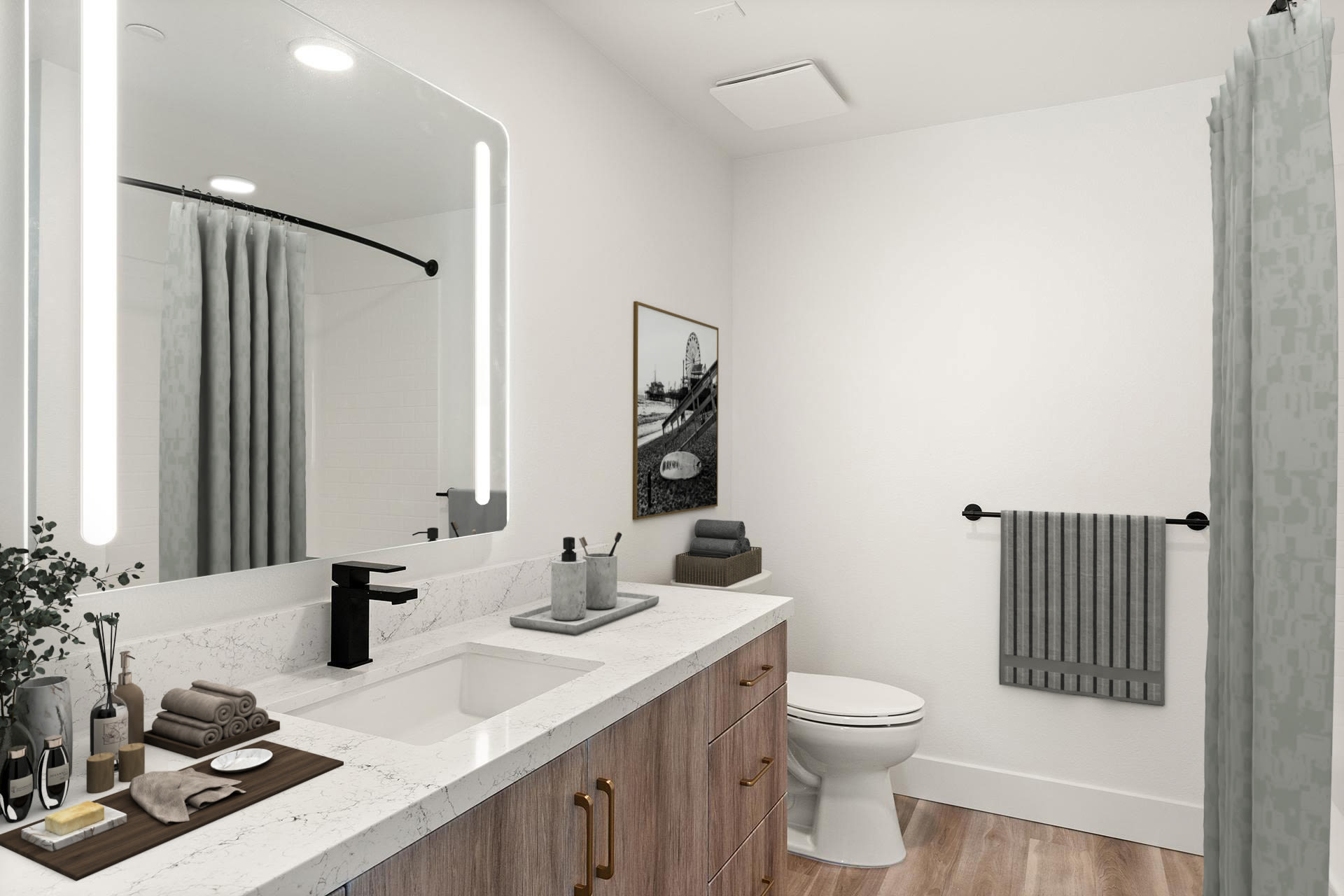 Sleek bathroom with long vanity, modern fixtures, and walk‑in shower at Colony Parc in Ventura, California