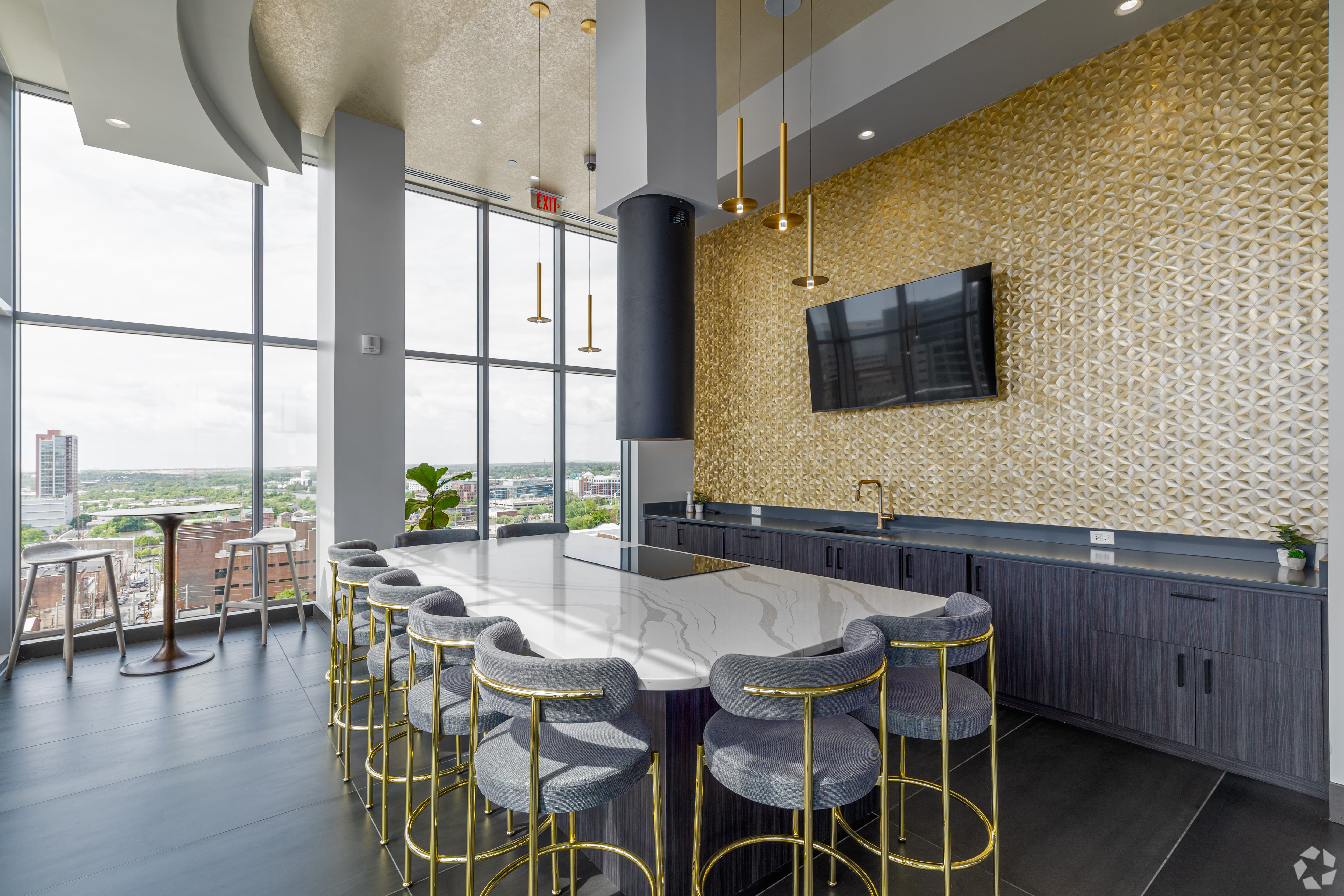 Table seating and a TV in the clubhouse at Crosby Hill in Wilmington, Delaware