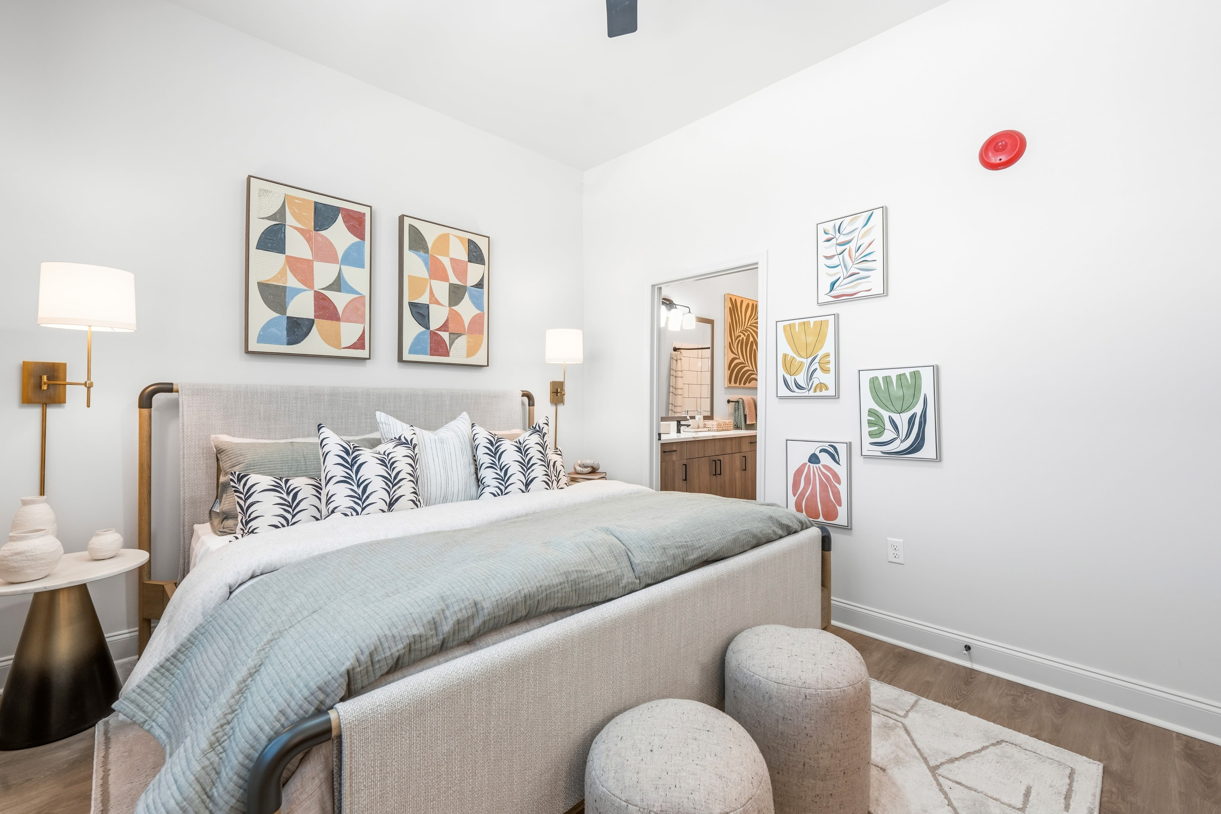 A furnished apartment bedroom at Evergreen Westside in Gainesville, Florida