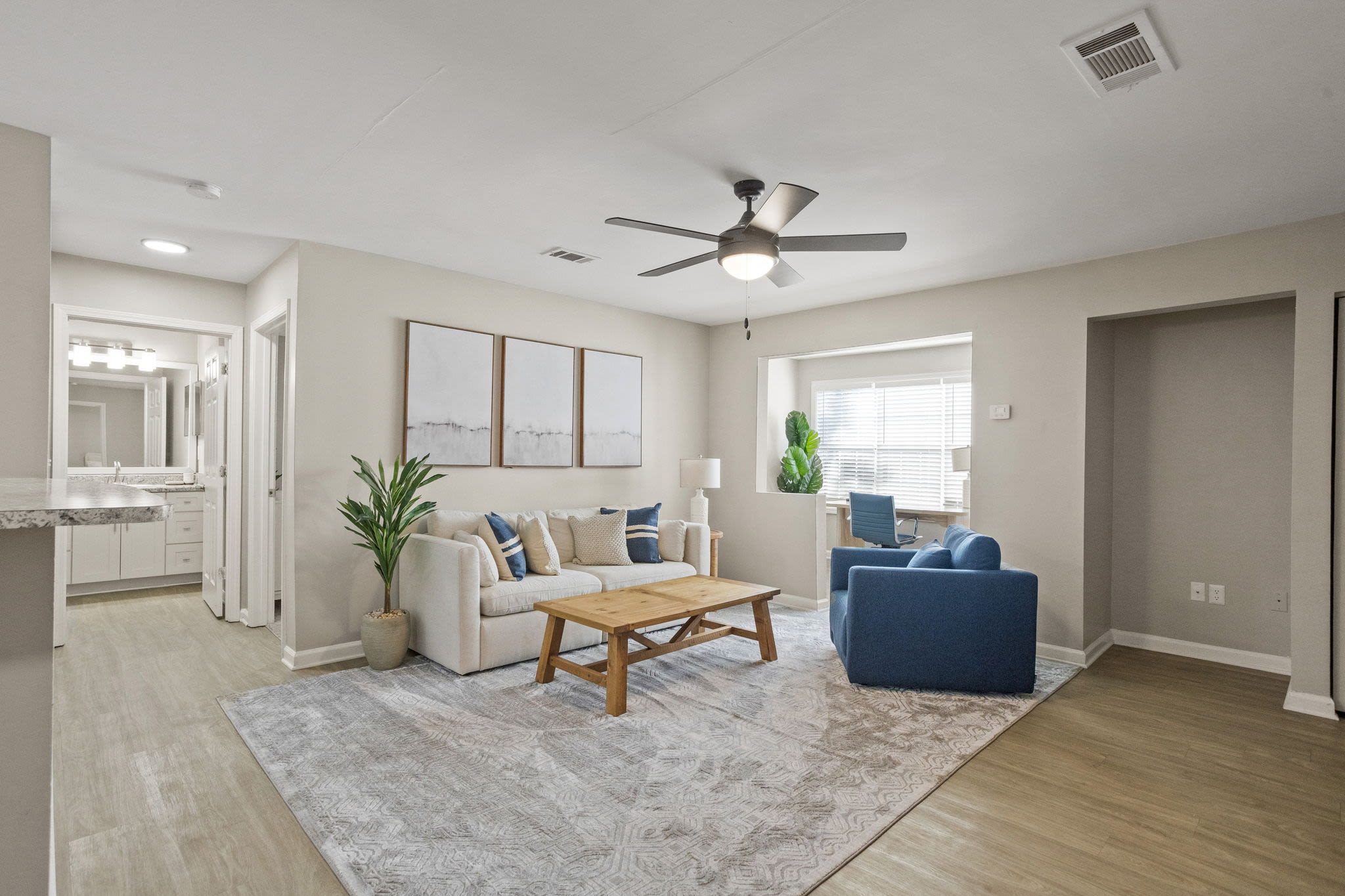 the-george-apartments-savannah-ga-renovated-apartment-living-room-with-hardwood-style-flooring