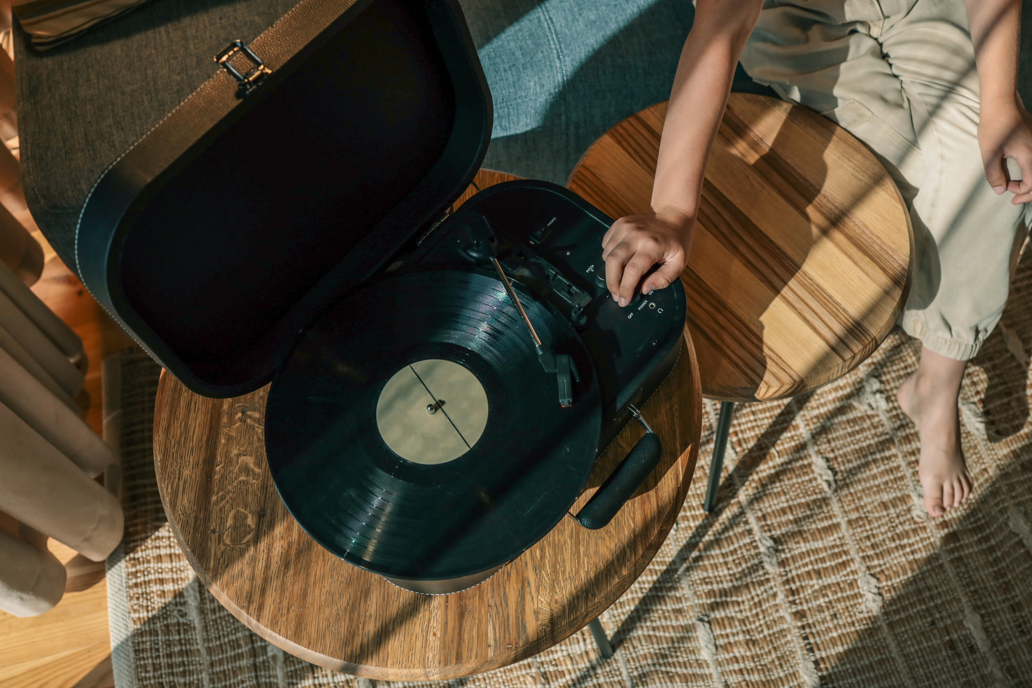 A resident using a turntable at The Colton in Redwood City, California