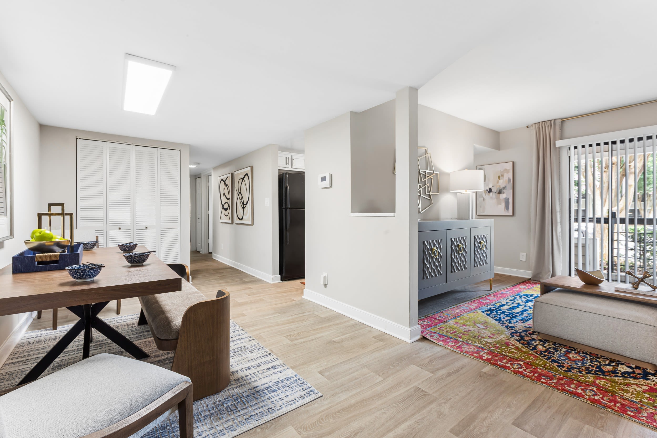Well-lit living room with access to patio at Reserve South in Richmond, Virginia