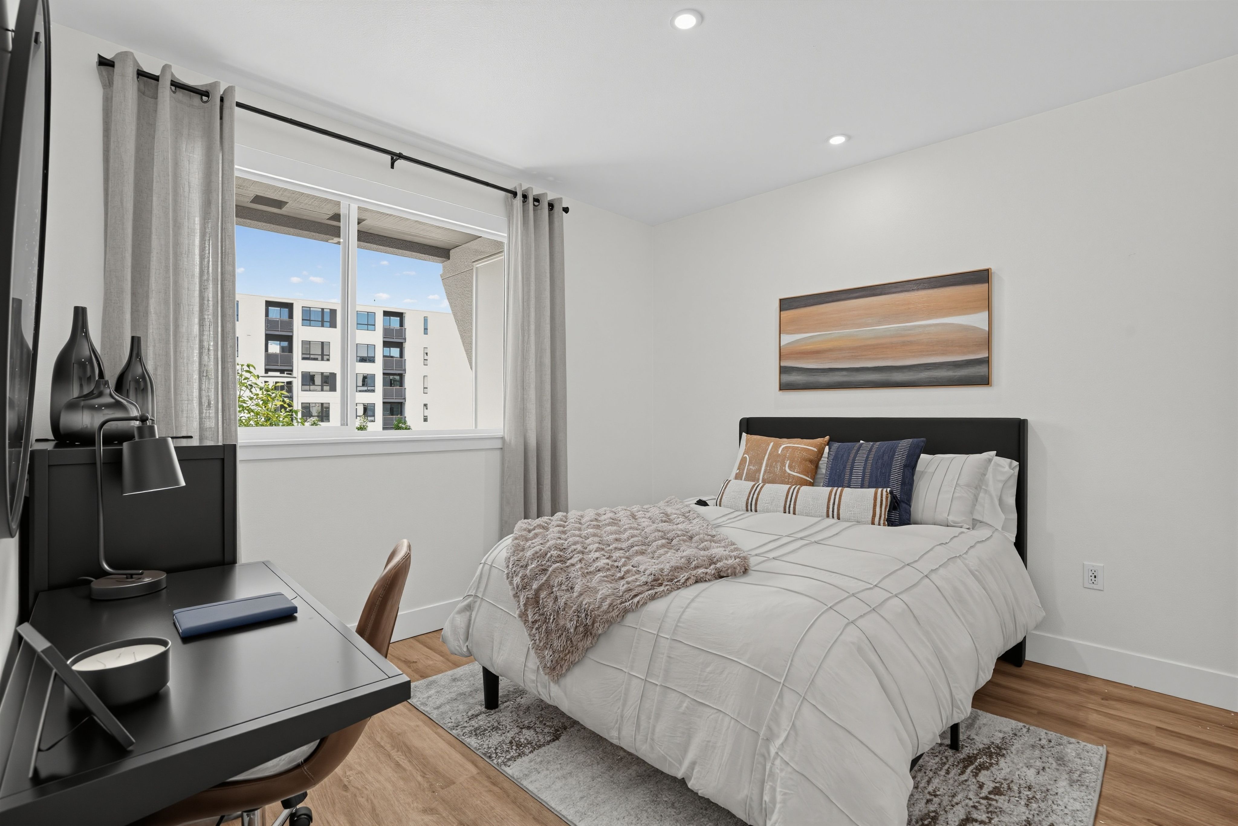 Bedroom with a closet, bed and nightstand at The Colton in Redwood City, California
