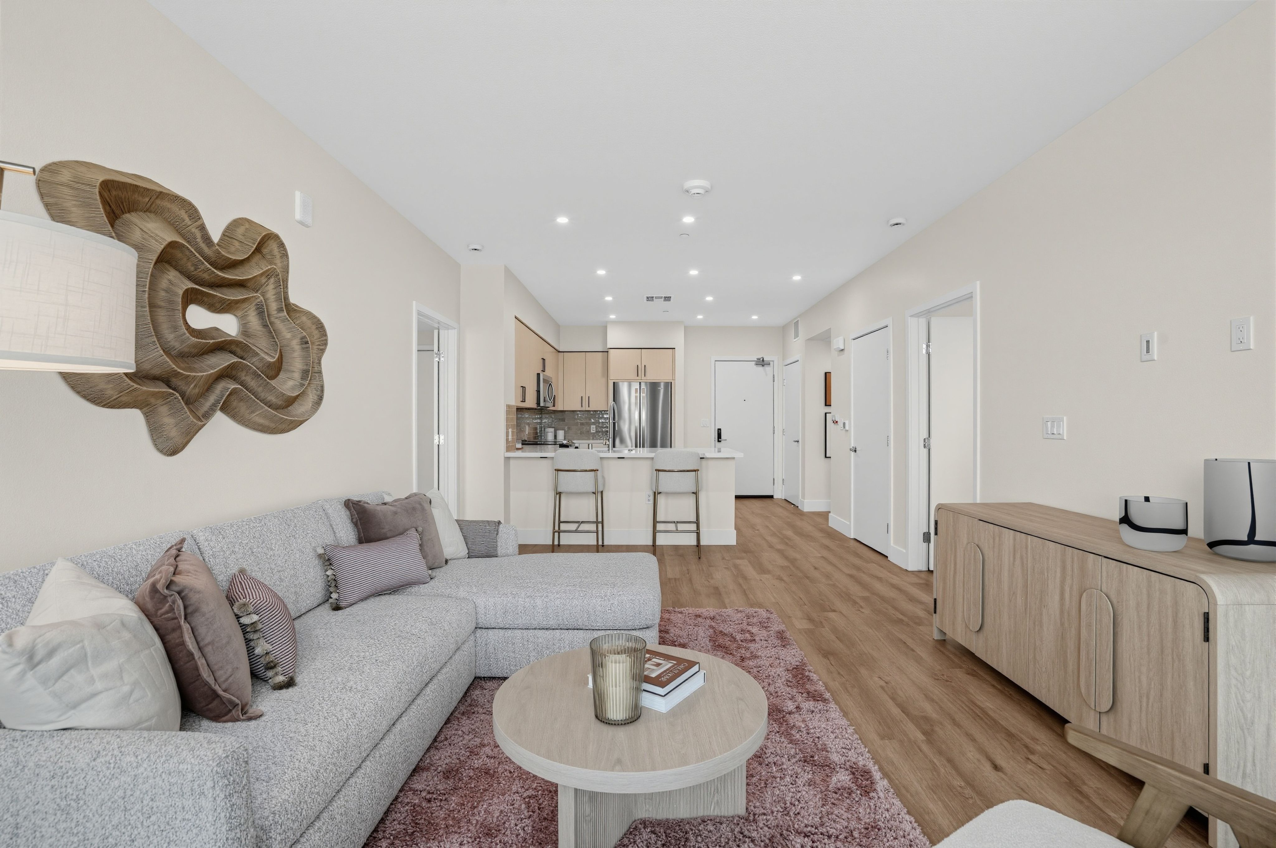 Open-concept living room with modern furniture at The Colton in Redwood City, California
