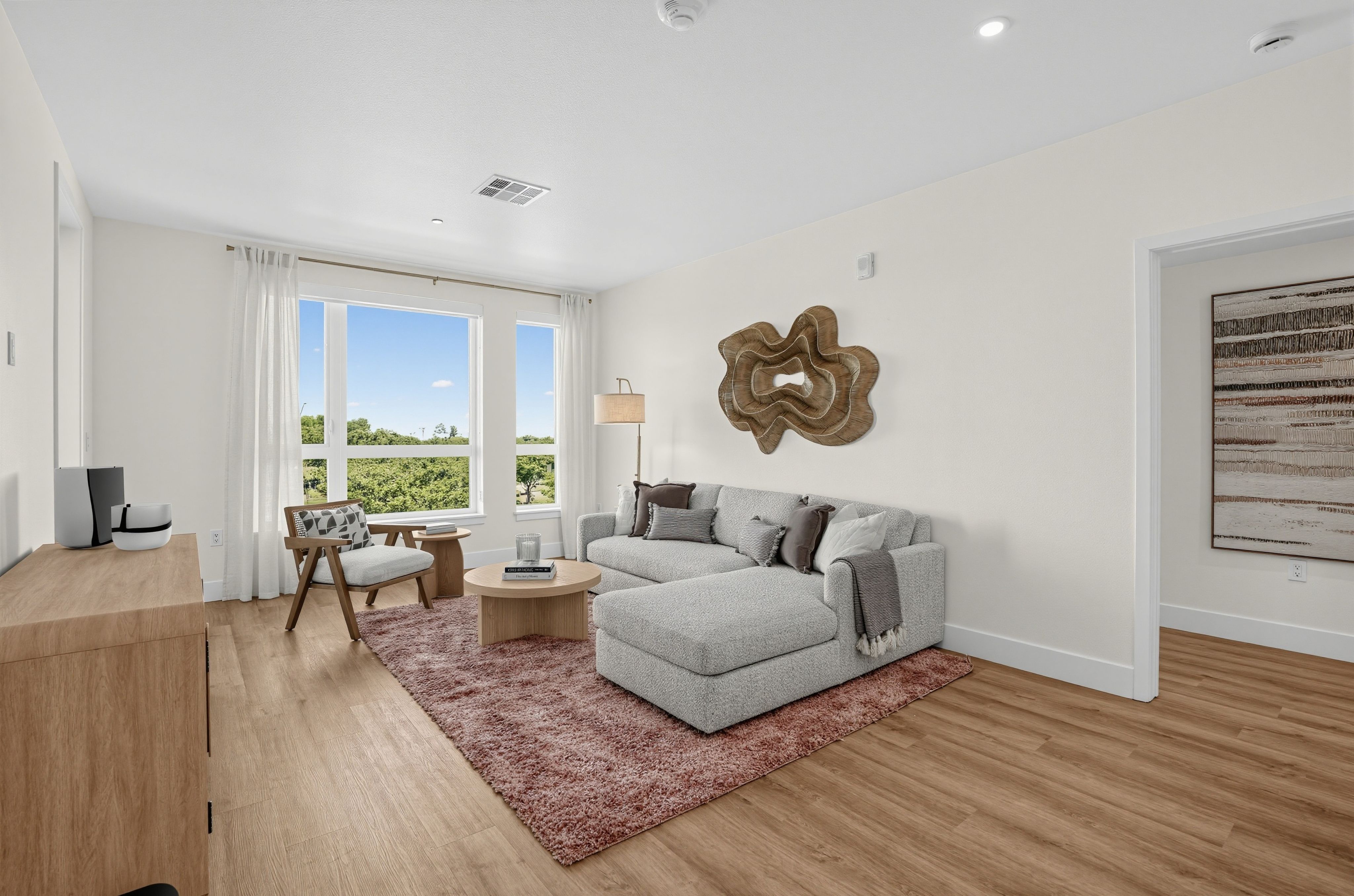 Modern living room with a rug at The Colton in Redwood City, CA