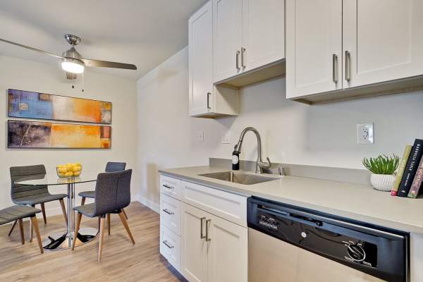 Kitchen and dining in model home at Polo Run Apartments in Stockton, California