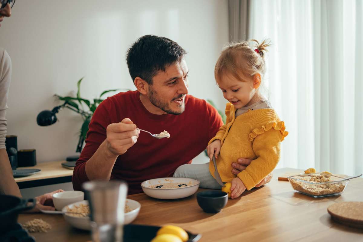 Resident with his daughter at Hampton Chase in Palestine, Texas