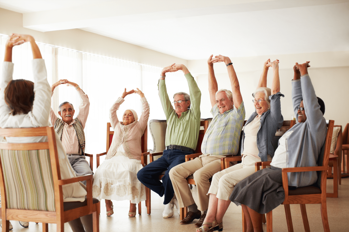 Residents participating in a fitness class at Arbor Rose Senior Care in Mesa, Arizona