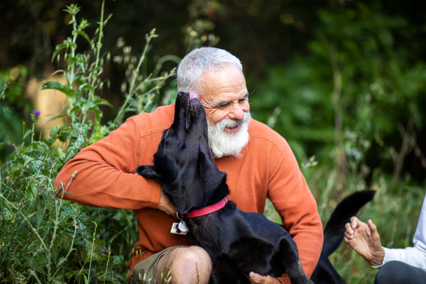 A resident and his dog at The Grand Court Senior Living in Mesa, Arizona.